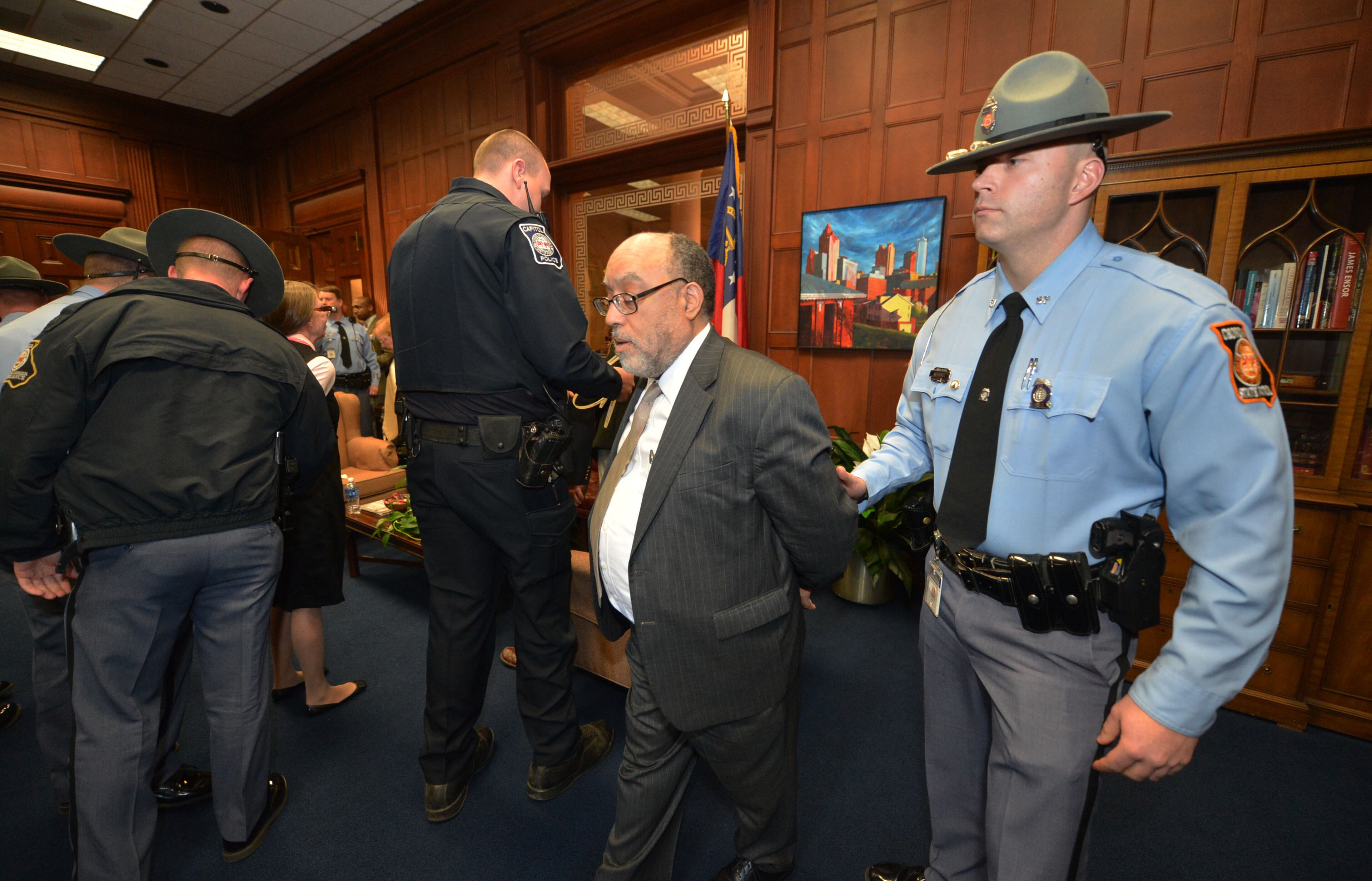 Ten protesters, including State Sen Vincent Fort, were arrested in the Governor's Office shortly after 5 pm Monday, Jan. 27, 2014. Georgia's "Moral Mondays" organizers, hope to turn up the heat on the issue of Medicaid expansion. KENT D JOHNSON/KDJOHNSON@AJC.COM