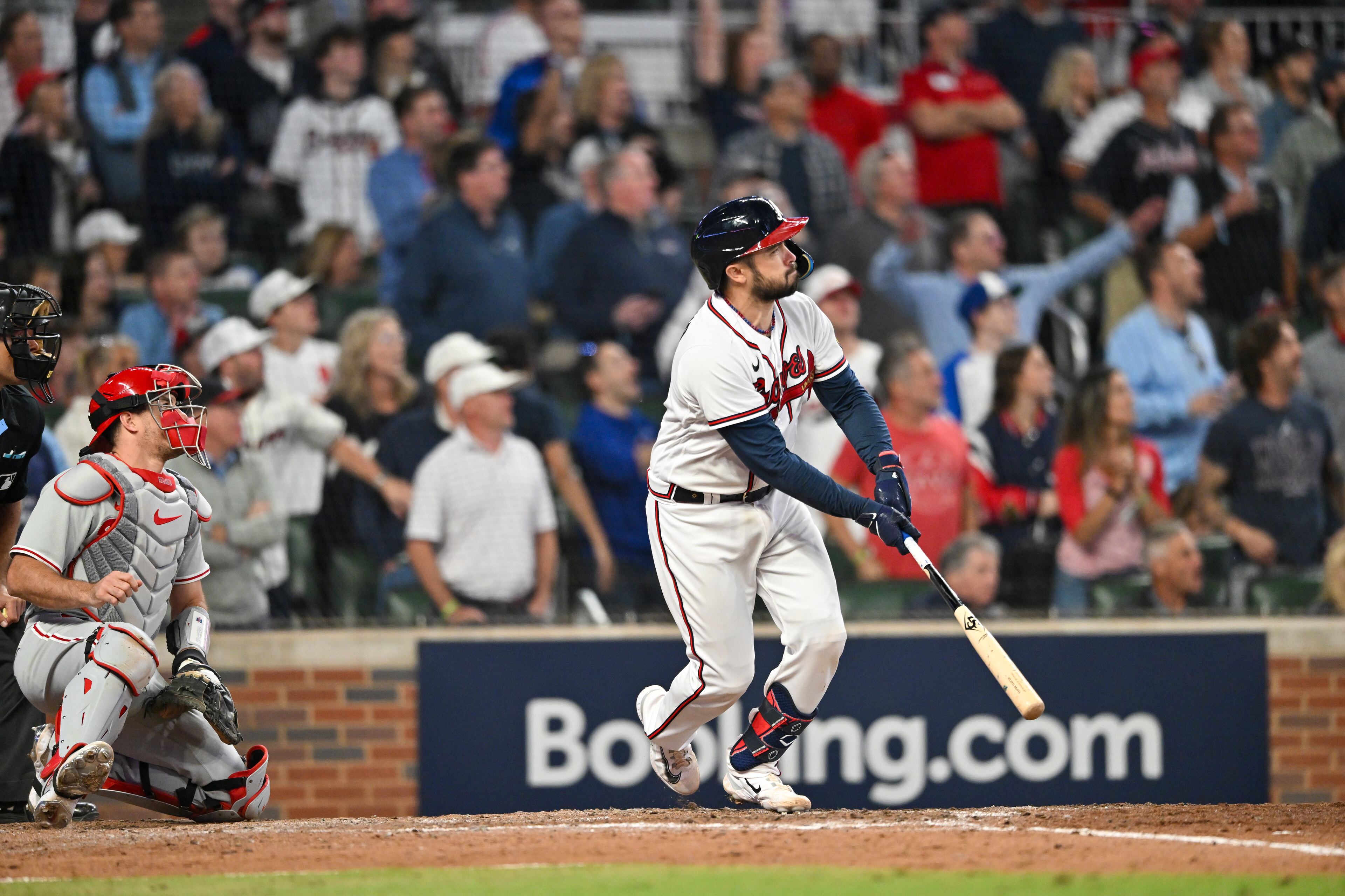 Atlanta Braves catcher Travis d'Arnaud (16) hits a two-run home run against the Philadelphia Phillies during the seventh inning of NLDS Game 2 in Atlanta on Monday, Oct. 9, 2023. (Hyosub Shin / Hyosub.Shin@ajc.com)