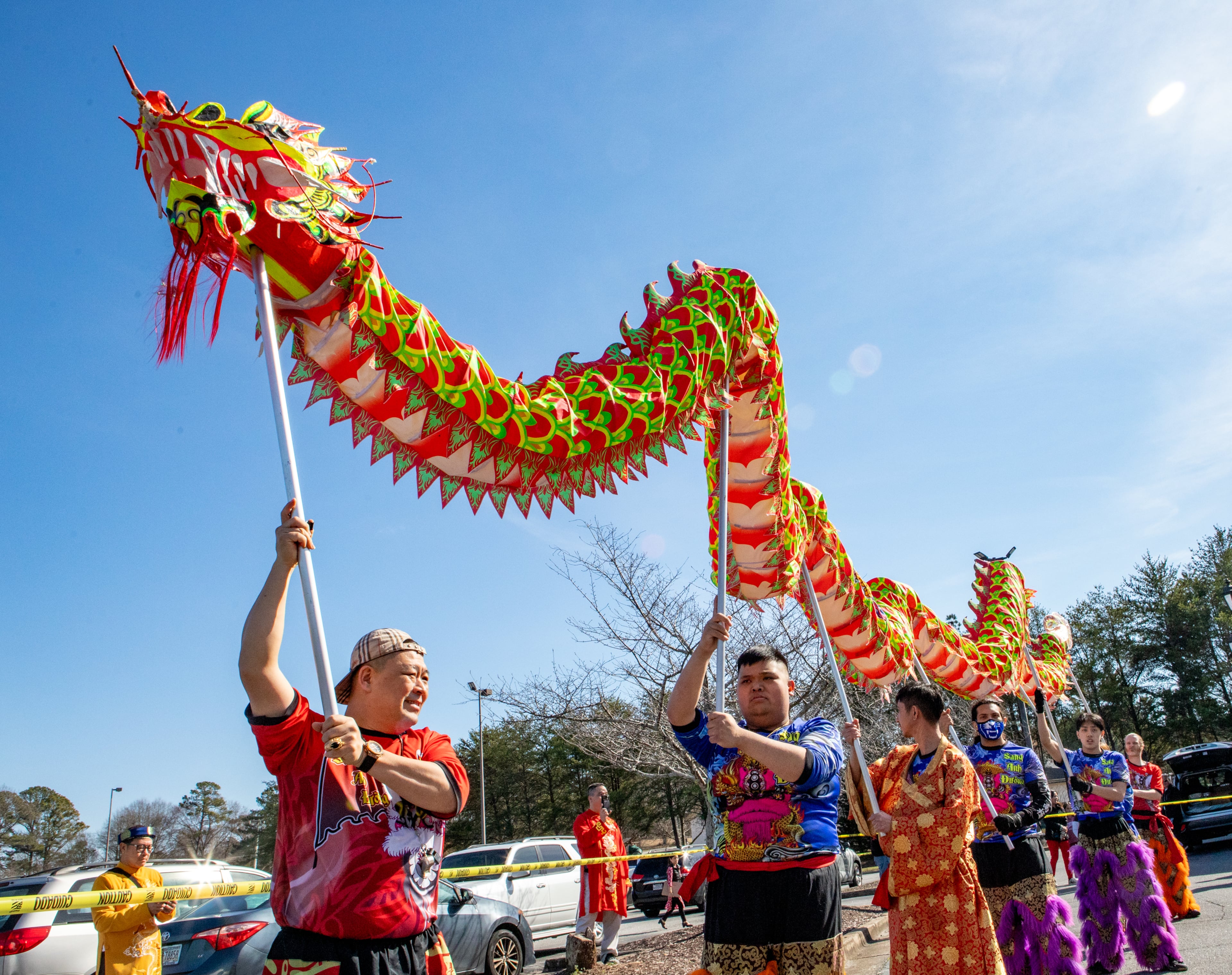 Sang Tran controls the head of the dragon and begins the weekend of celebration on Saturday, Feb 3, 2024. The Vietnamese American Community of Georgia hosts a Lunar New Year celebration at Plaza Las Americas in Lilburn where dragon and lion dancing begins the weekend. The celebration continues on Sunday and includes traditional food, music and cultural festivities. (Jenni Girtman for The Atlanta Journal-Constitution)