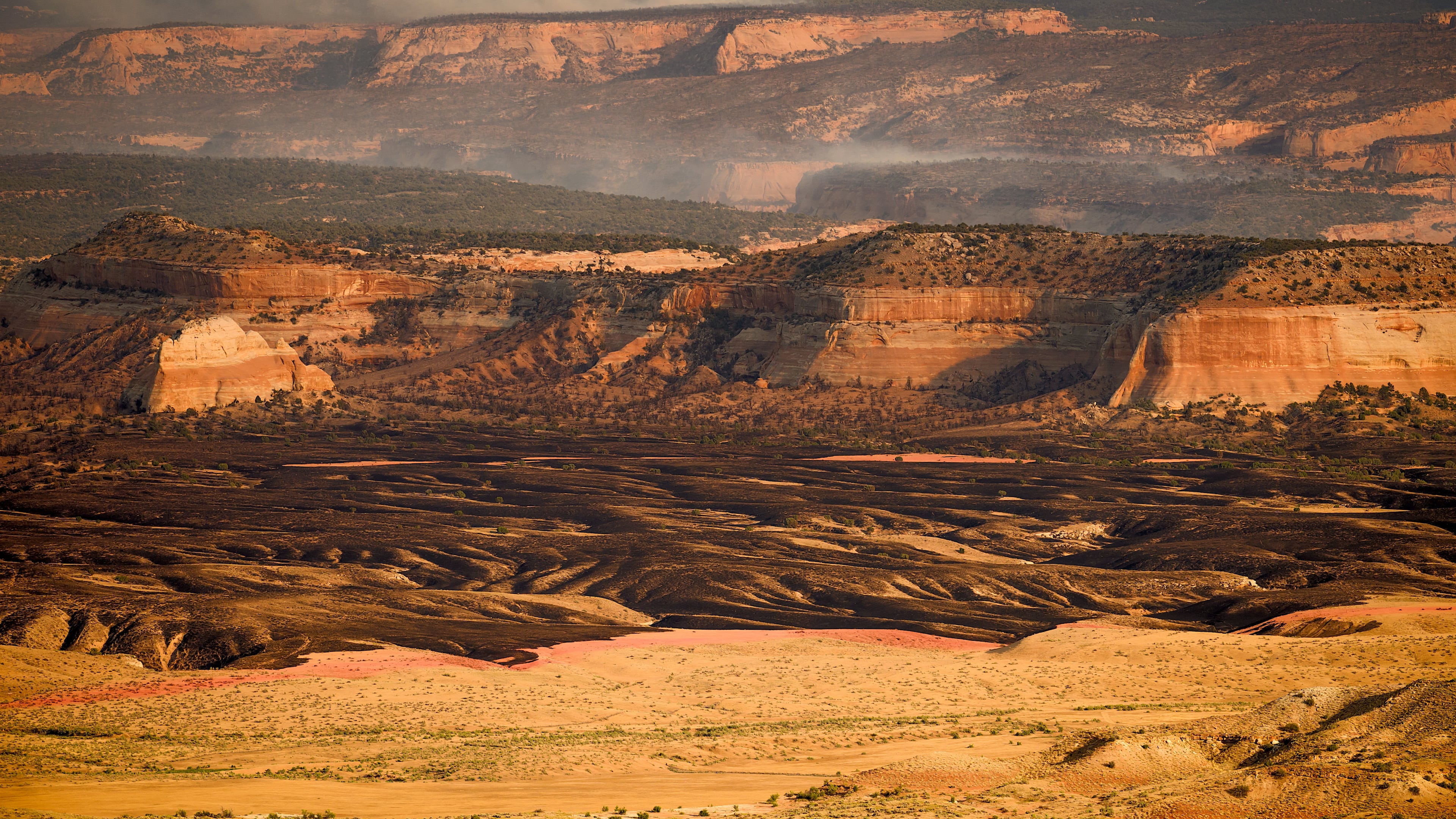 Smoke rises from the Snyder Fire burning near Thompson Springs, Utah, on Sunday, June 28, 2026. (AP Photo/Noah Berger)