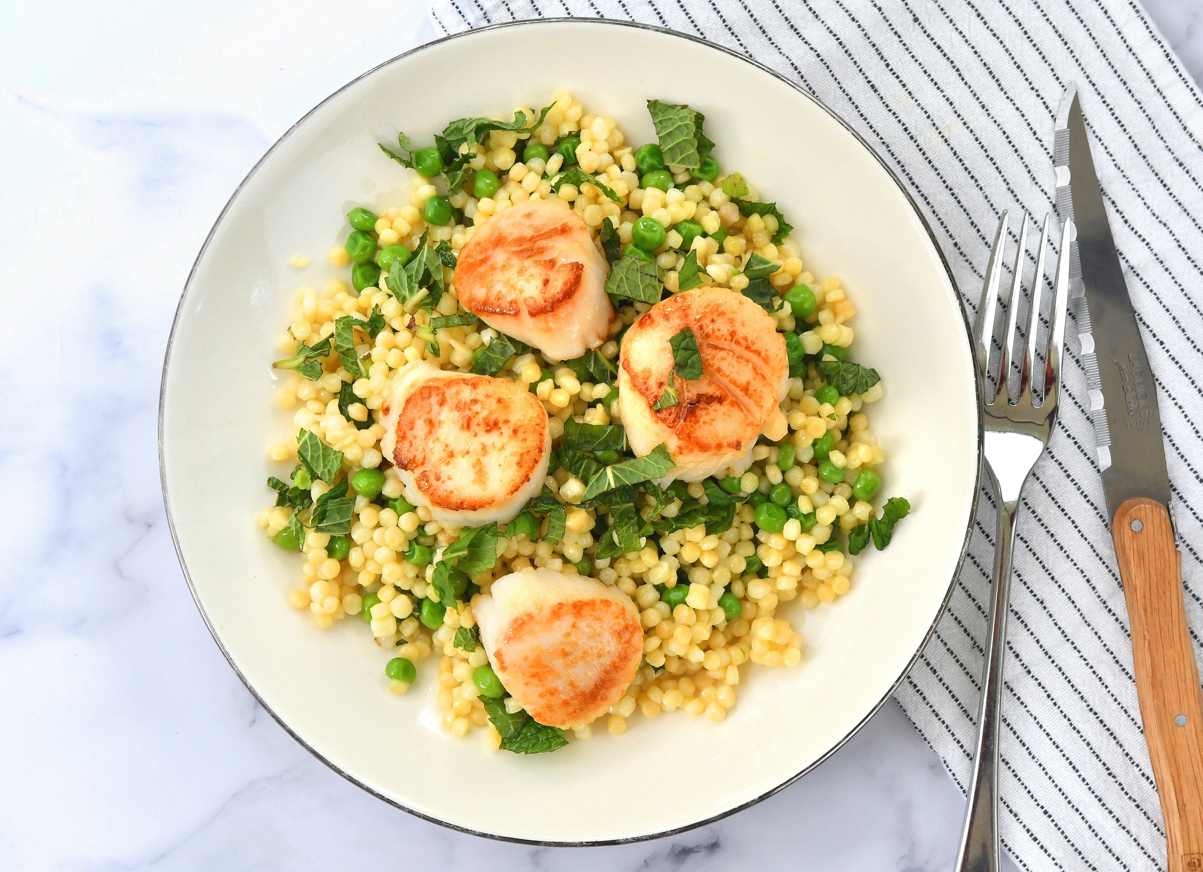 Seared Scallops with Minty Peas and Couscous.
Chris Hunt for The Atlanta Journal-Constitution
