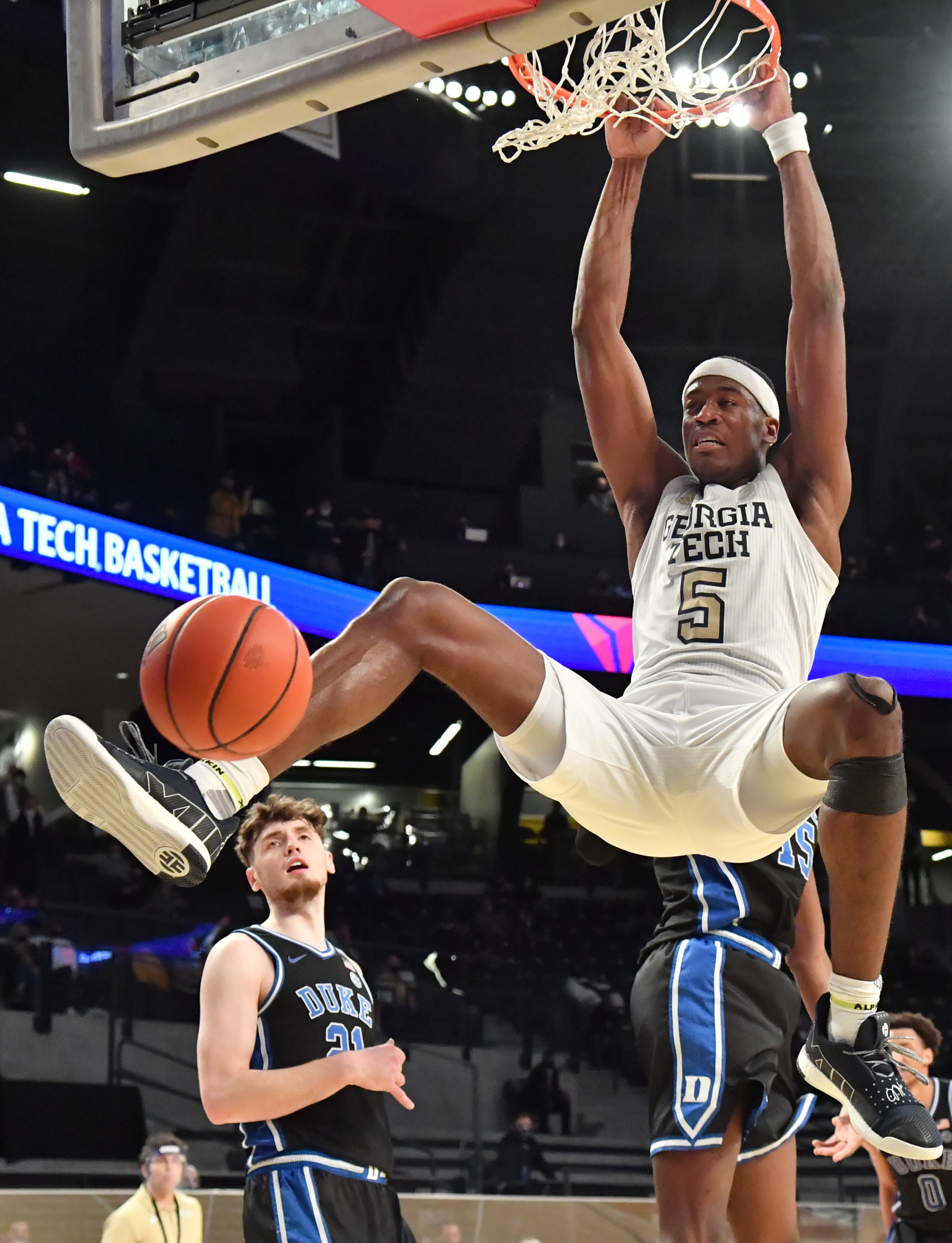 March 2, 2021 Atlanta - Georgia Tech's forward Moses Wright (5) hangs on the basket after dunking the ball in the second half of an NCAA college basketball game at Georgia Tech's McCamish Pavilion in Atlanta on Tuesday, March 2, 2021. Georgia Tech won 81-77 over Duke in overtime. (Hyosub Shin / Hyosub.Shin@ajc.com)