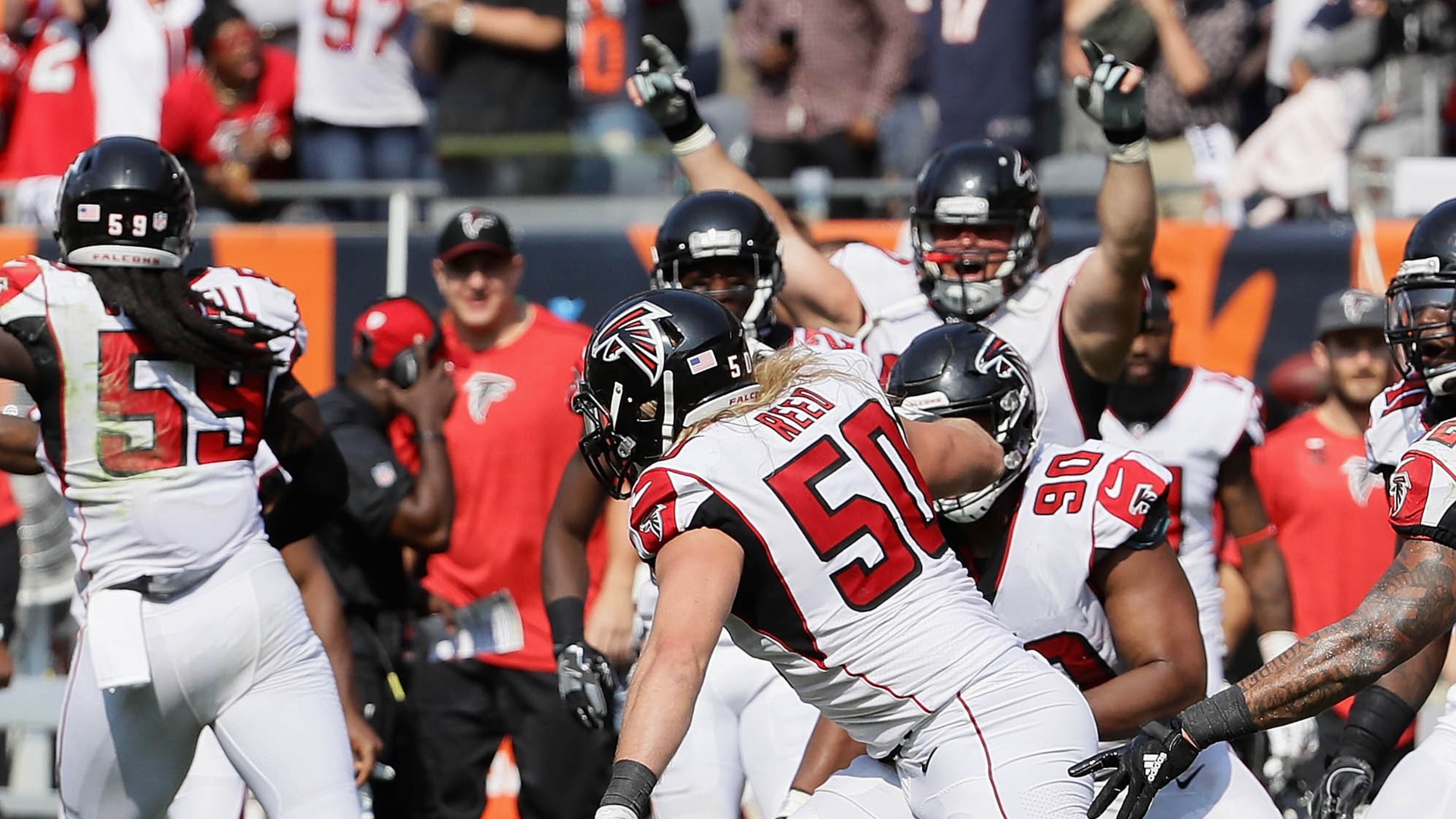 CHICAGO, IL - SEPTEMBER 10: Brooks Reed #50 of the Atlanta Falcons celebrates with teammates after sacking Mike Glennon #8 of the Chicago Bears on the next to last play during the season opening game at Soldier Field on September 10, 2017 in Chicago, Illinois. The Falcons defeated the Bears 23-17. (Photo by Jonathan Daniel/Getty Images)