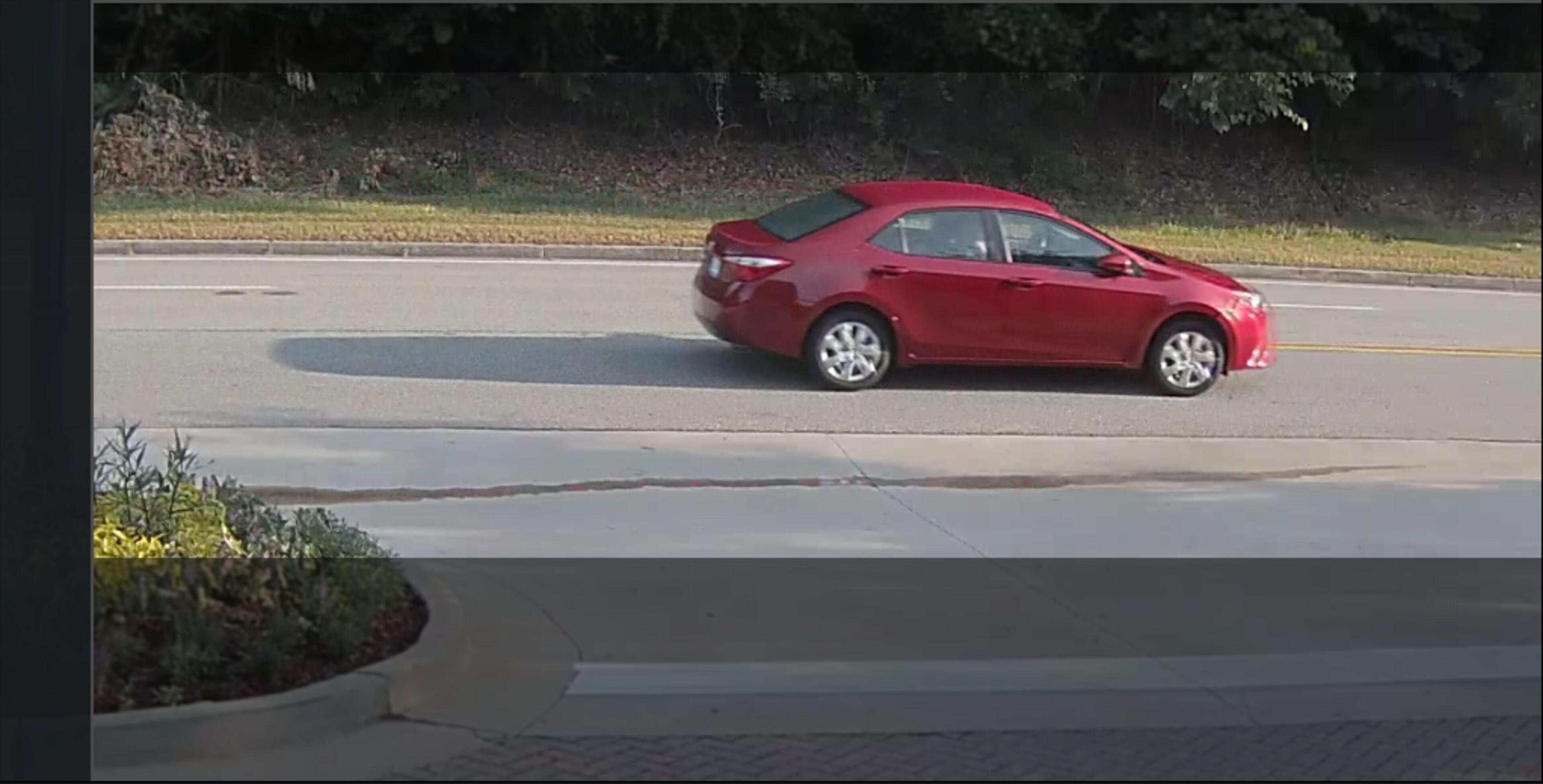 Investigators believe the car that hit a Sandy Springs officer Monday morning on Powers Ferry Road was a red, newer model Toyota Corolla.