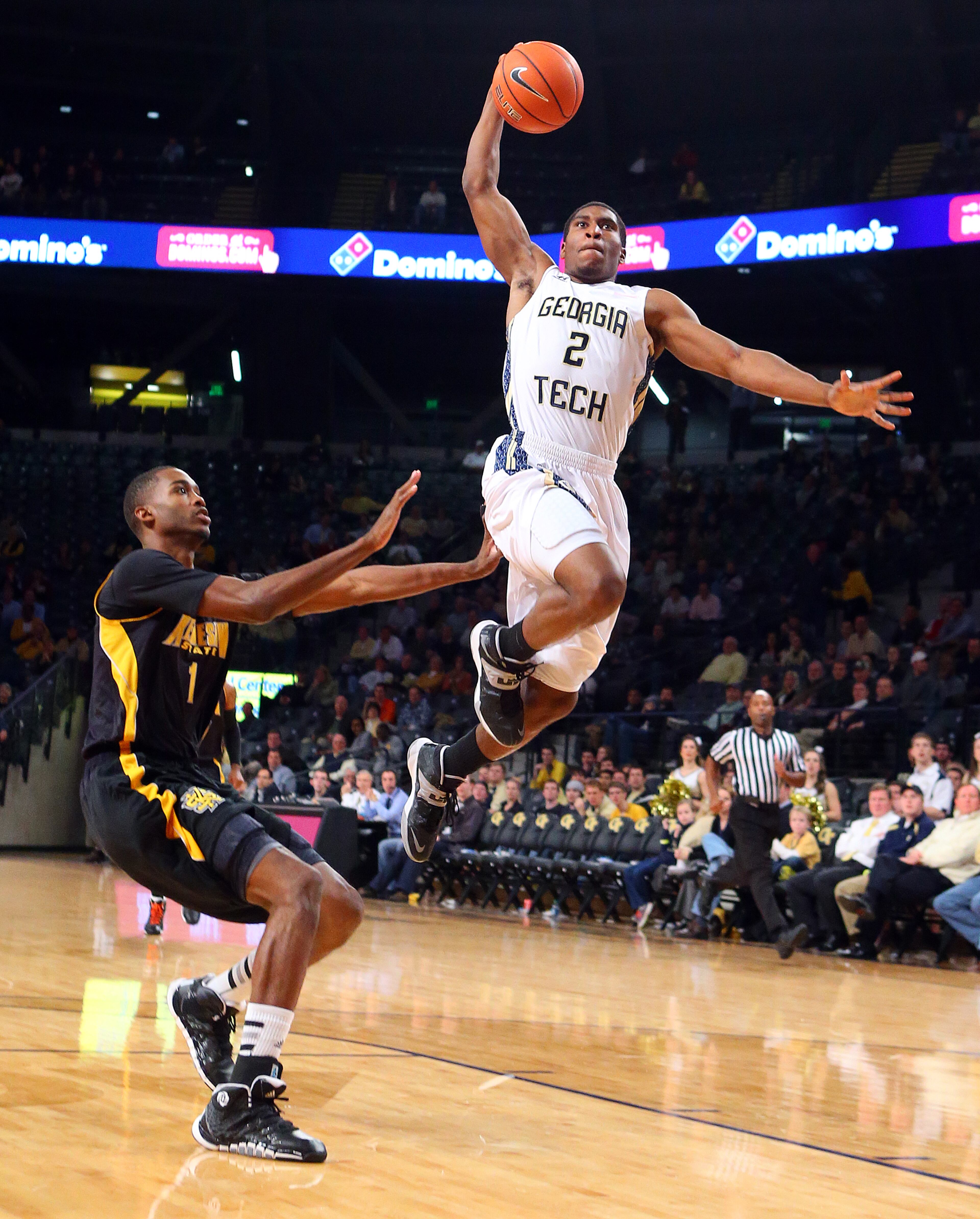 Georgia Tech guard Solomon Poole goes airborne to the basket past Kennesaw State Owls forward Nigel Pruitt during the first half of a college basketball game on Monday, Dec. 16, 2013, in Atlanta.