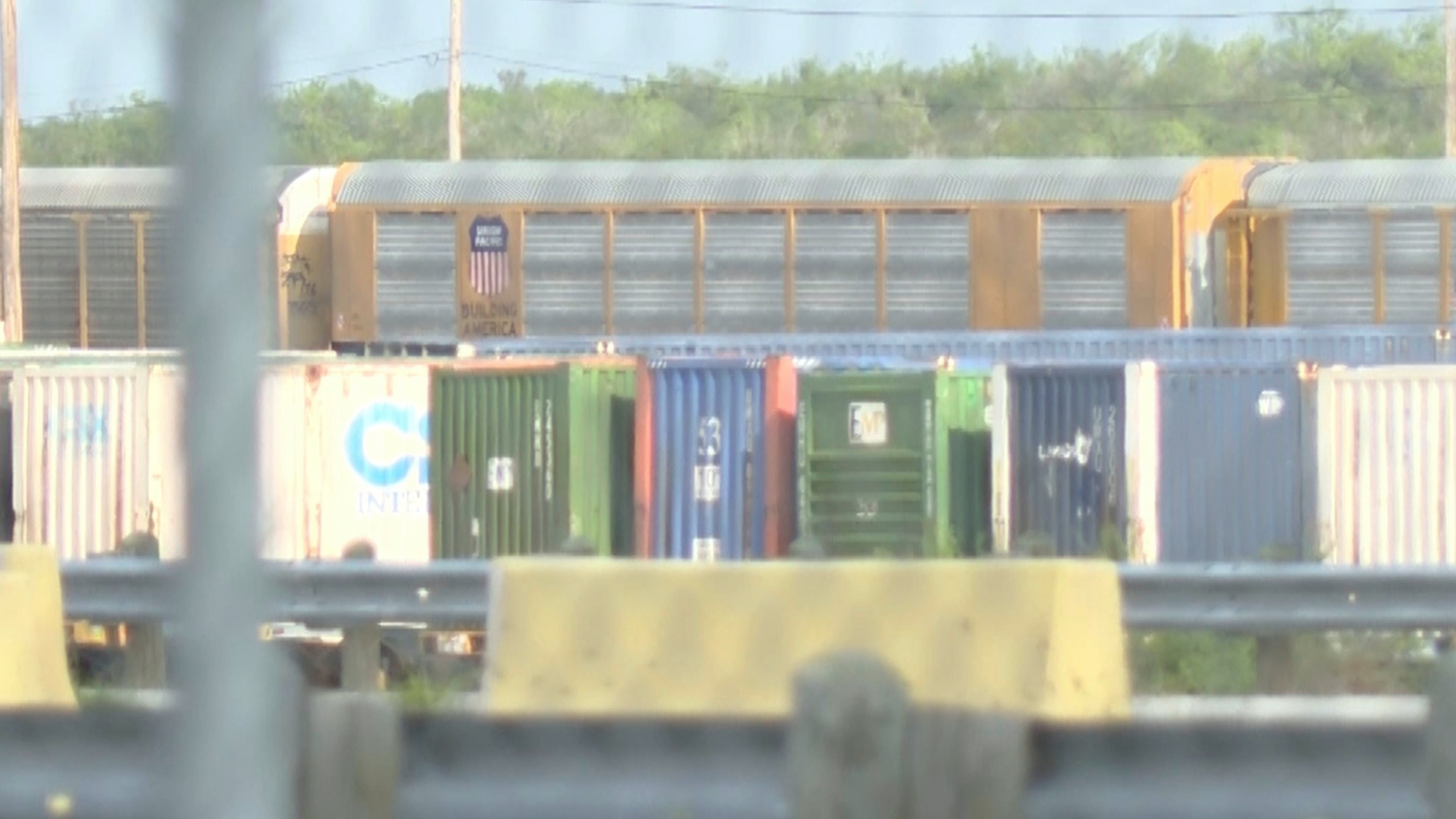 In this image taken from video footage provided by KGNS, Union Pacific train cars are stationed at a rail yard in Laredo, Texas, Sunday, May 10, 2026. (KGNS via AP)
