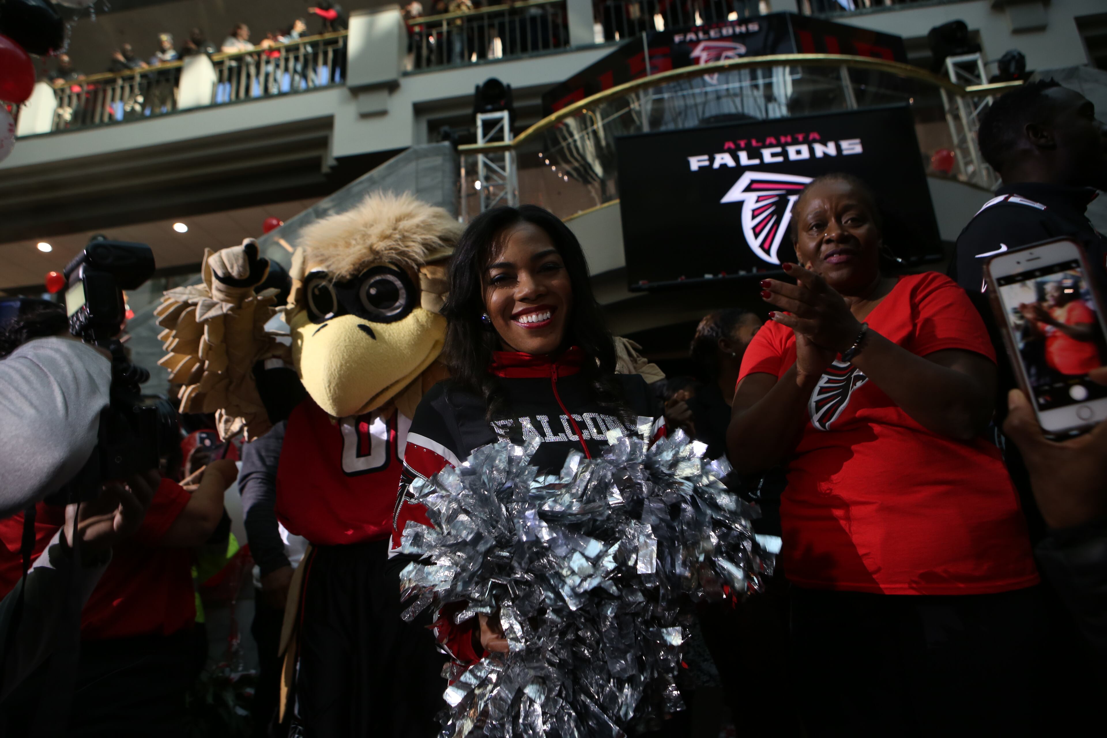 January 27, 2017, Atlanta, Georgia - A Falcons cheerleader celebrates with the crowd about Atlanta return to the Super Bowl at the Atlanta Falcons pep rally held by Mayor Kasim Reed at City hall in Atlanta, Georgia, on Friday, January 27, 2017. (HENRY TAYLOR / HENRY.TAYLOR@AJC.COM)