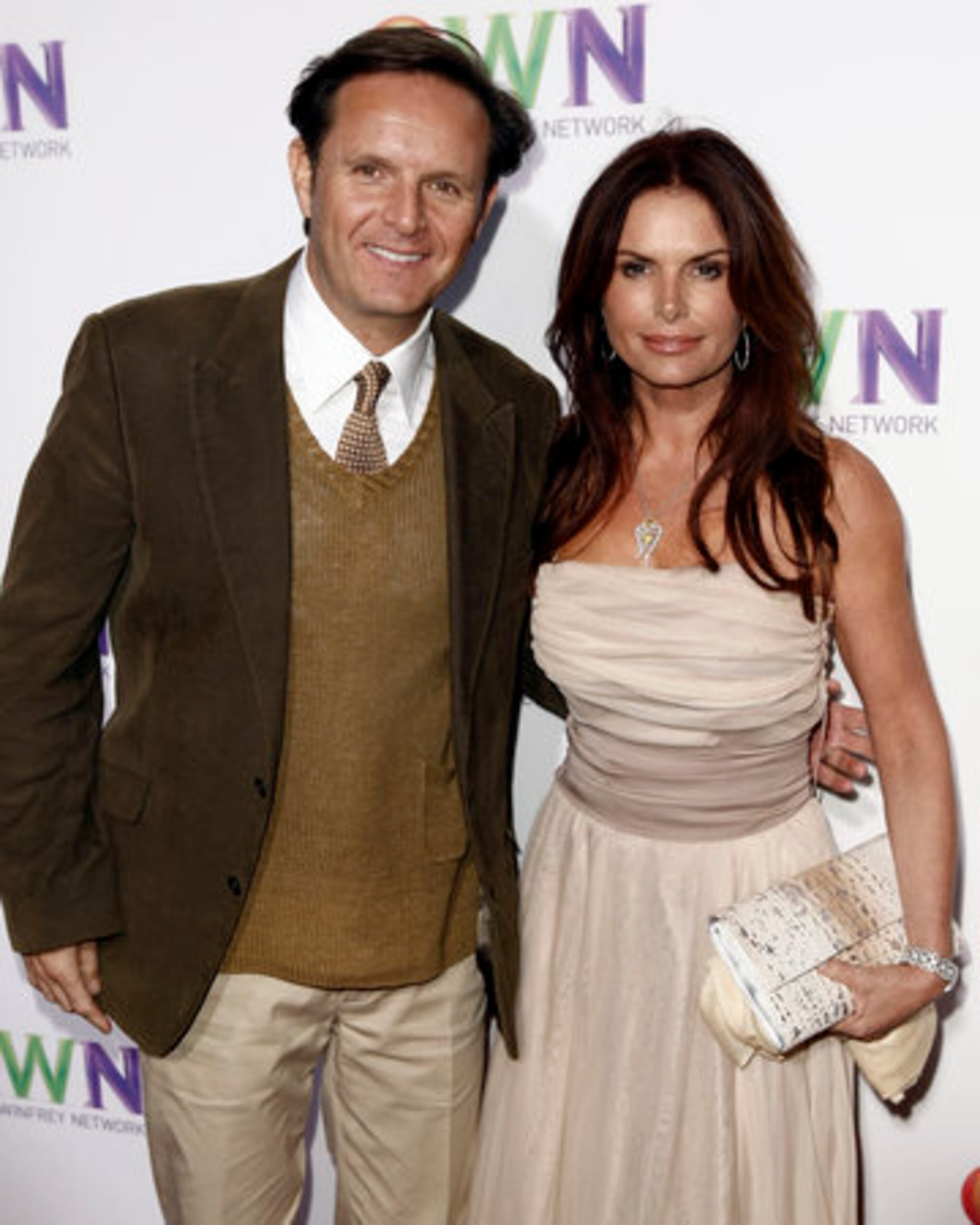 Super producer Mark Burnett, with Roma Downey, will produce a talk show for OWN. "If Oprah would've asked me to ride a unicycle naked backward at night, I would've said 'Where do I sign up?'" he says.
