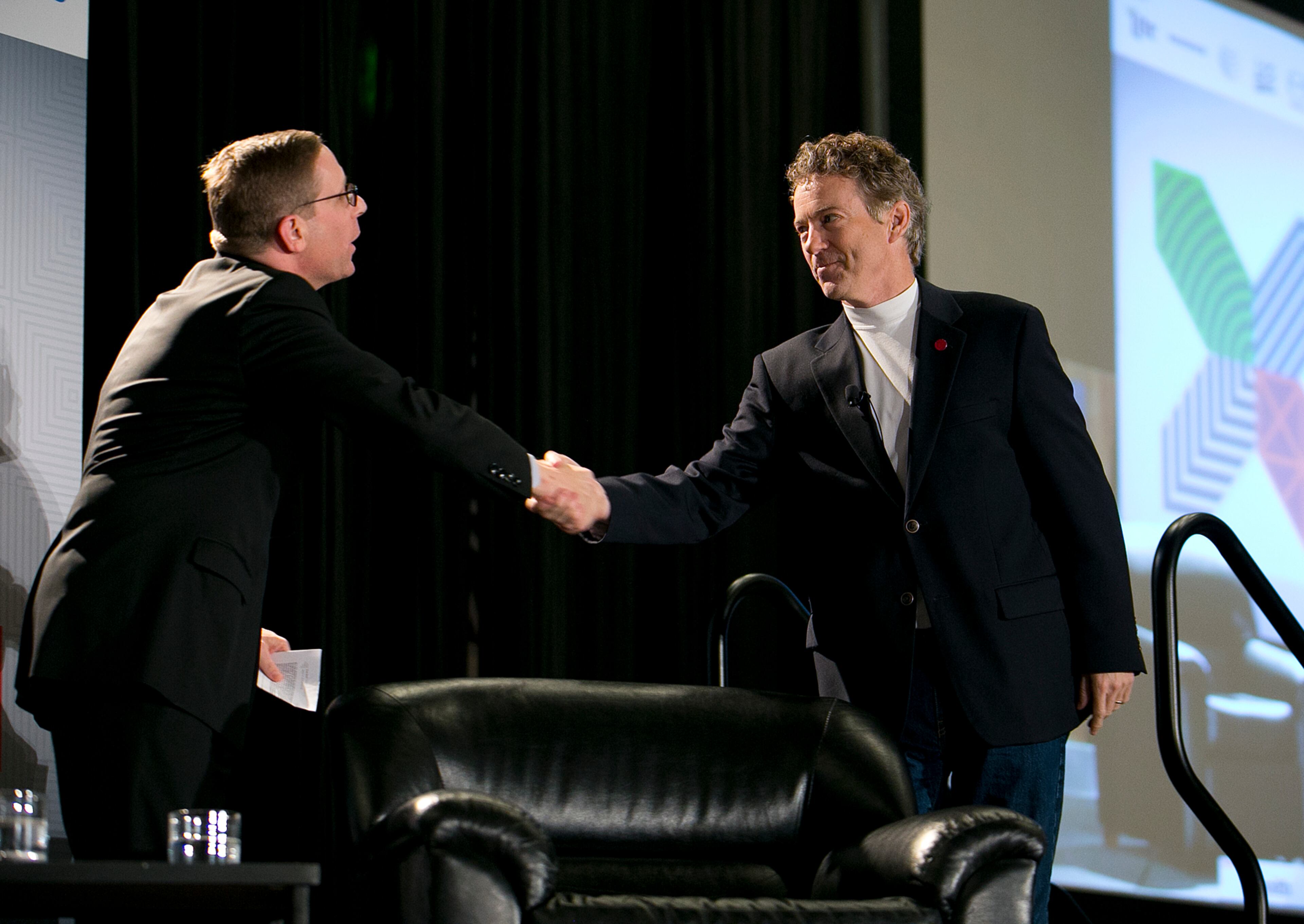 Senator Rand Paul, right, greets Texas Tribune's Evan Smith during their talk at SXSW at the JW Marriott on Sunday, March 15, 2015. DEBORAH CANNON / AMERICAN-STATESMAN