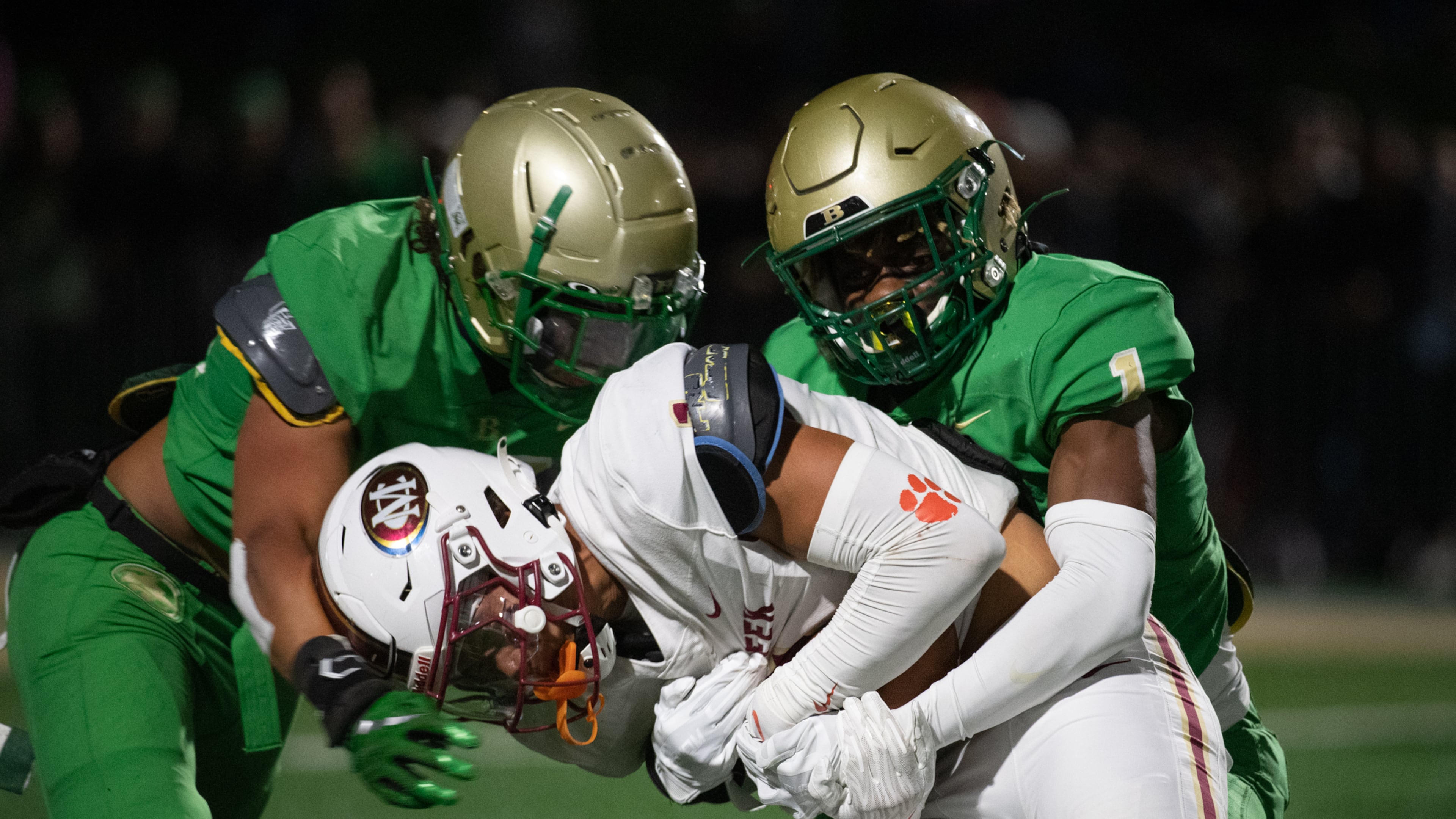Jamal Anderson gets taken down at the Buford/Mill Creek football game (Photo Jamie Spaar for The Atlanta Journal-Constitution)