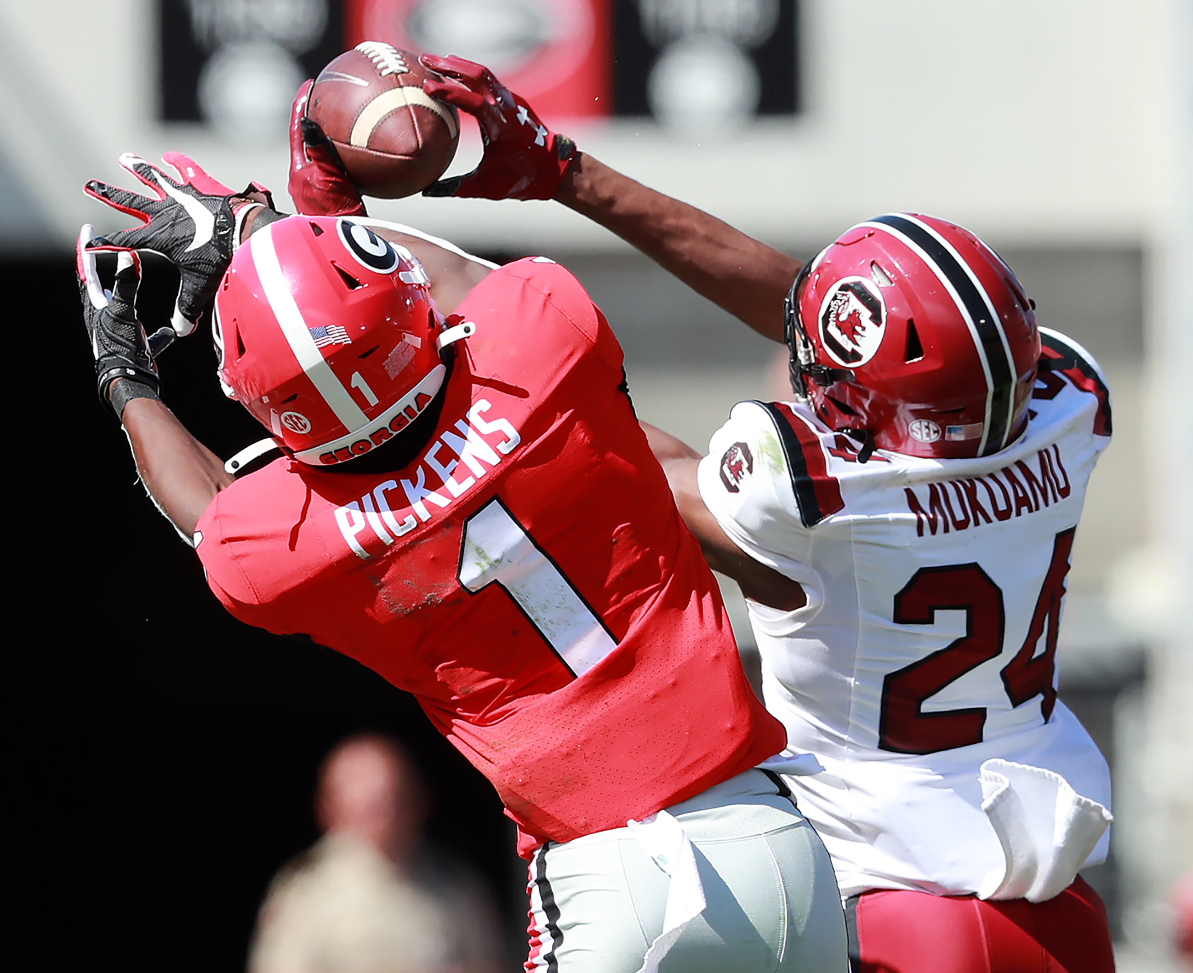 South Carolina defensive back Israel Mukuamu intercepts a Jake Fromm pass to Georgia wide receiver George Pickens and returns it for a touchdown and a 17-10 lead during the second quarter in a NCAA college football game on Saturday, October, 12, 2019, in Athens. Curtis Compton/ccompton@ajc.com