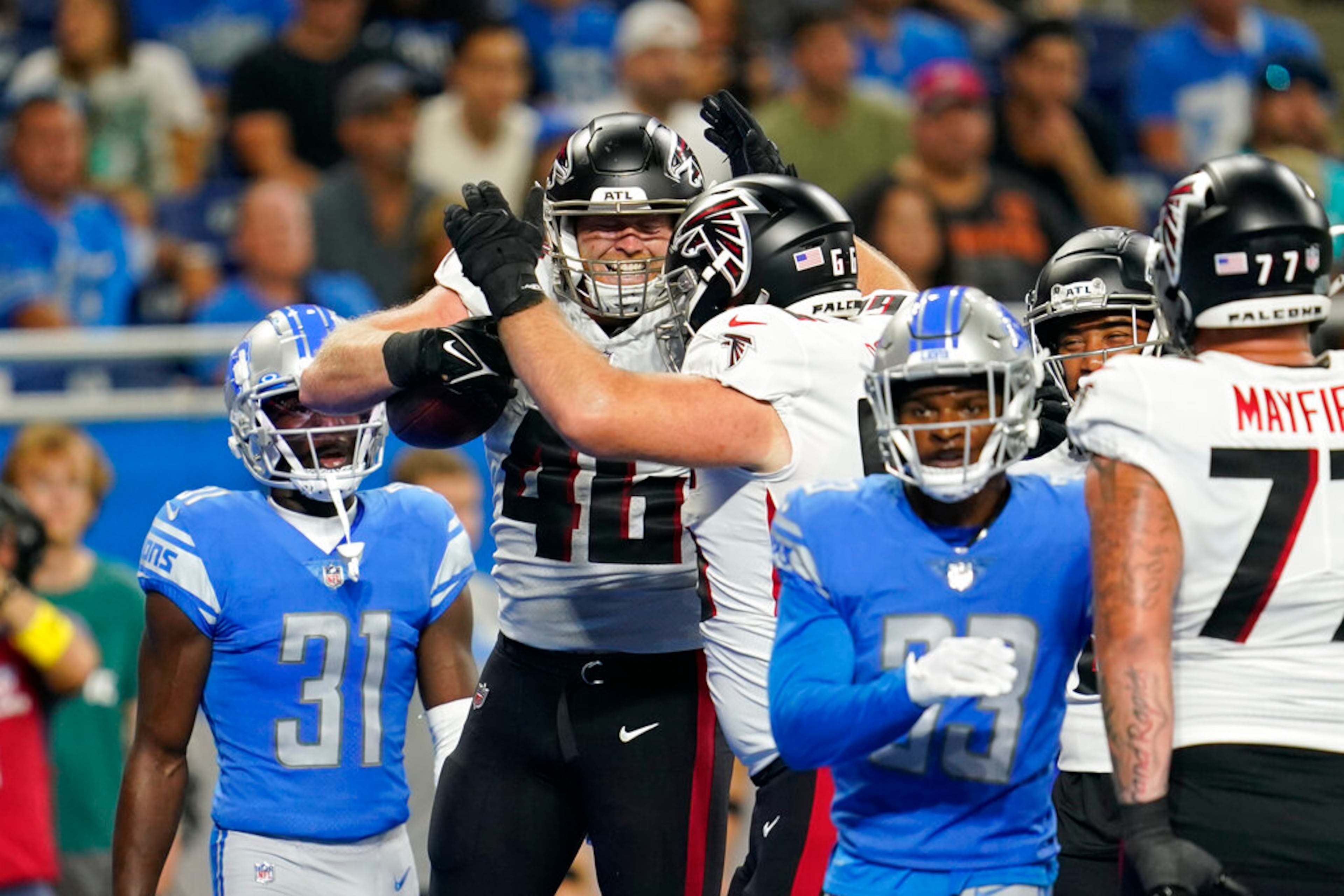 Atlanta Falcons tight end Parker Hesse (46) celebrates his touchdown with teammate guard Colby Gossett during the first half of a preseason NFL football game against the Detroit Lions, Friday, Aug. 12, 2022, in Detroit. (AP Photo/Paul Sancya)