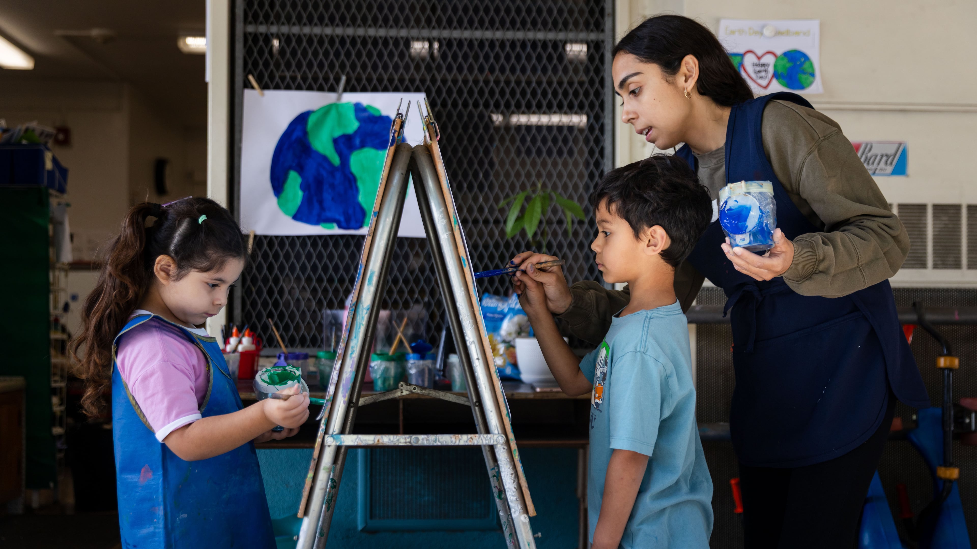 Students paint during a TK class at First Street Elementary School in Los Angeles, on Wednesday, April 22, 2026. (AP Photo/Ethan Swope)