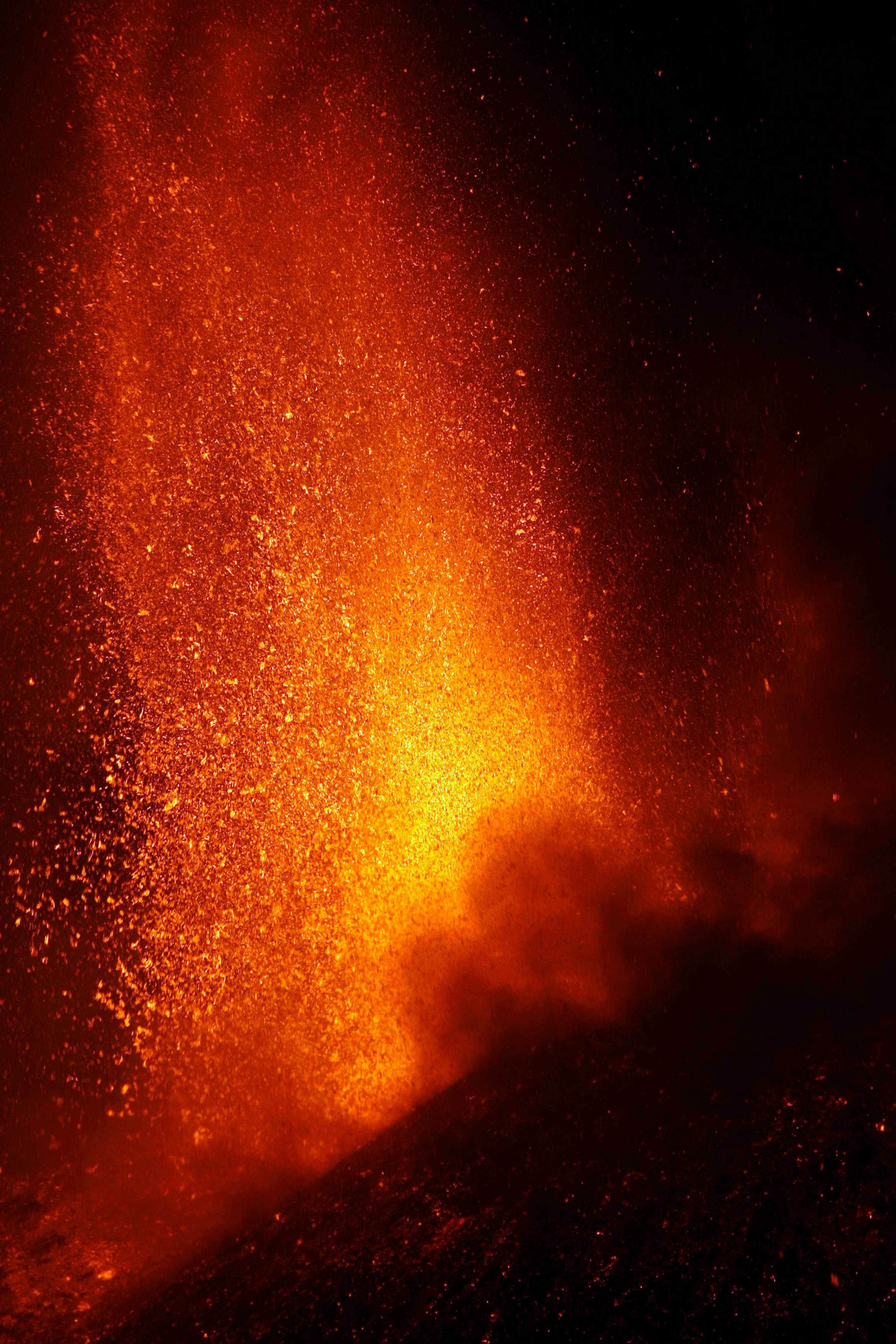 Italy's Mount Etna, Europe's tallest and most active volcano, spews lava as it erupts on the southern island of Sicily November 17, 2013. There were no reports of damage or evacuations in the area and the nearby airport of Catania was operating as normal, local media reported. It is the 16th time that Etna has erupted in 2013. The south-eastern crater, formed in 1971, has been the most active in recent years. REUTERS/Antonio Parrinello