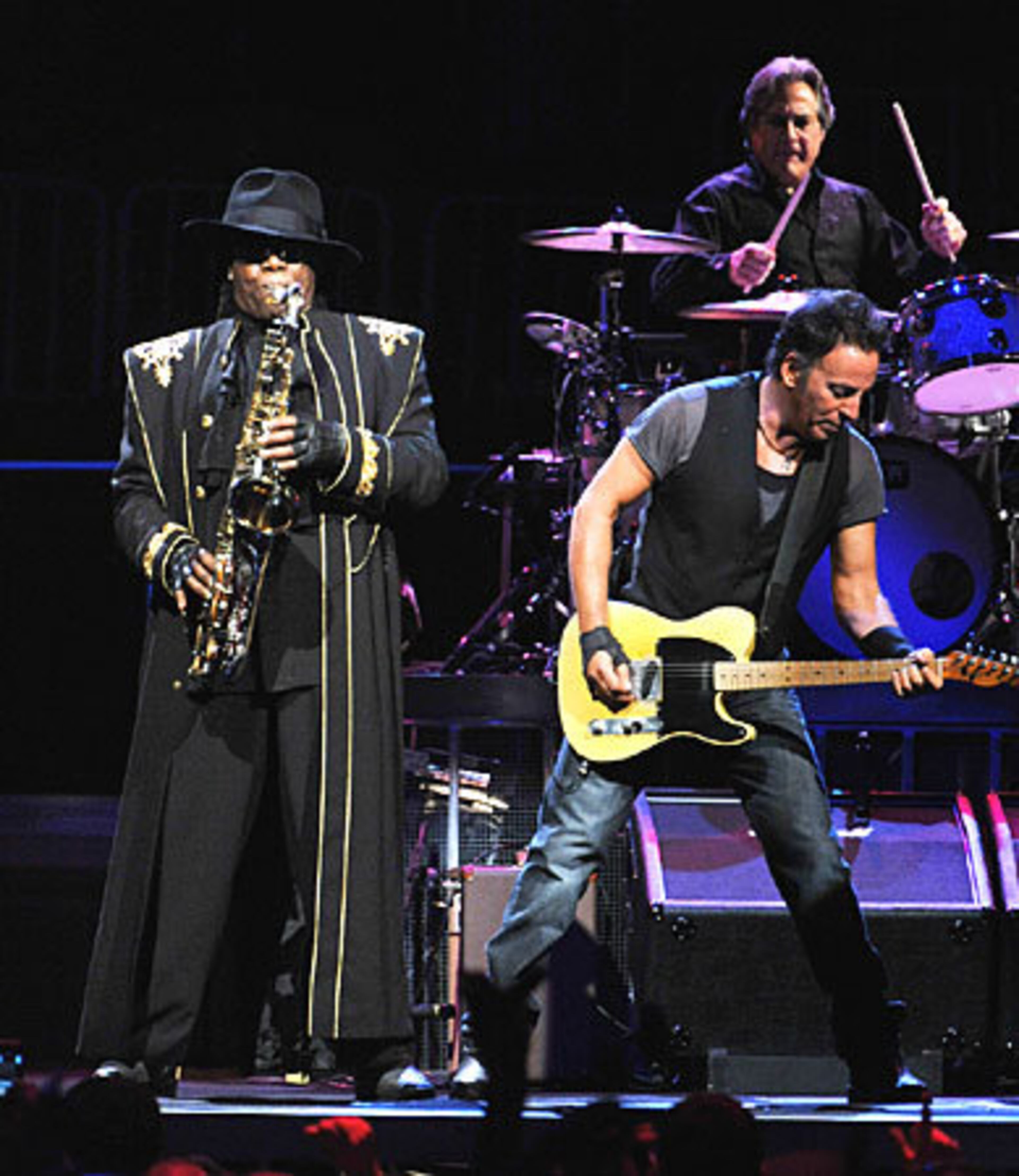 Bruce Springsteen with longtime band member Clarence Clemons on saxophone and drummer Max Weinberg.