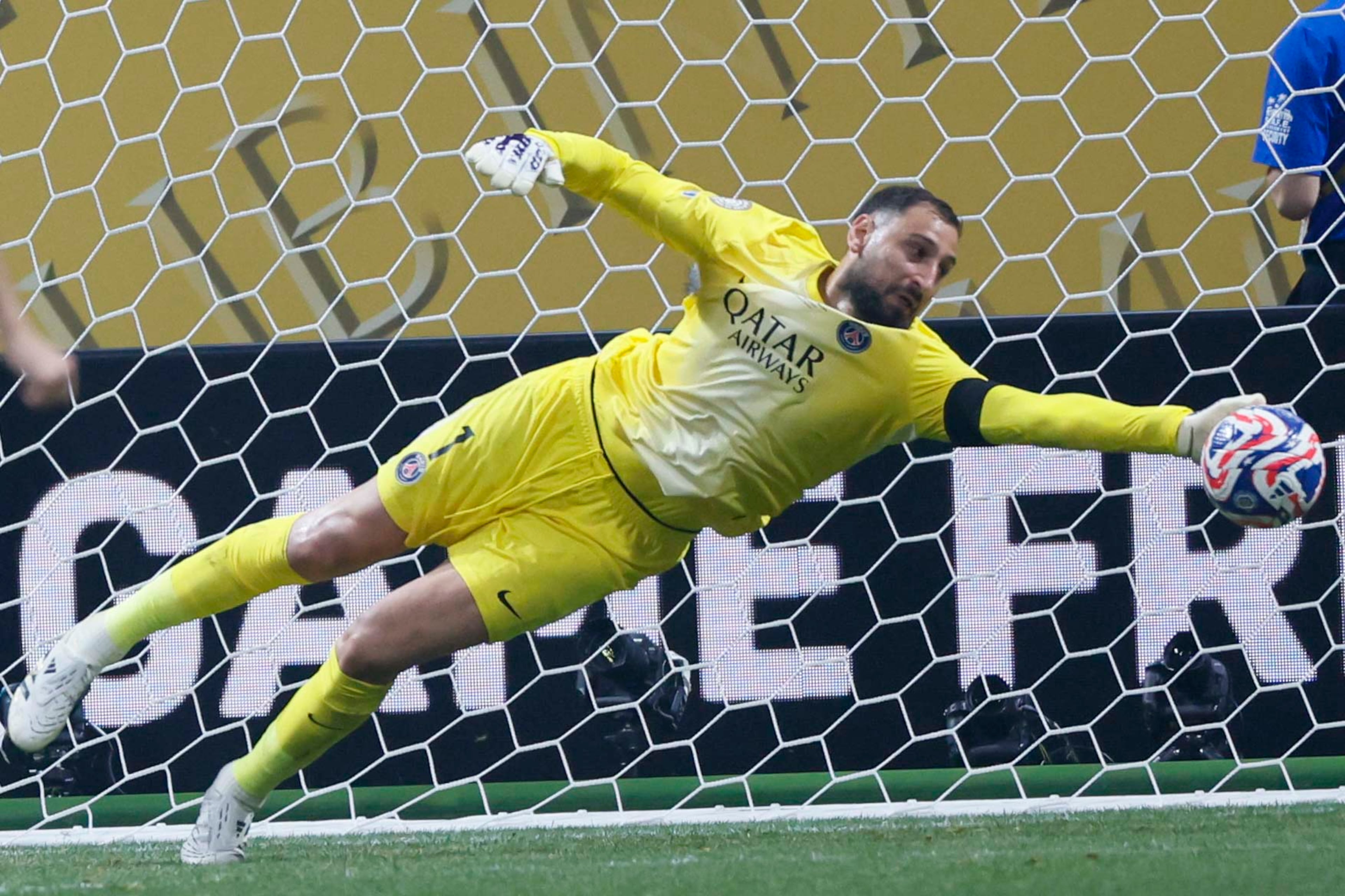 Paris Saint-Germain goalkeeper Gianluigi Donnarumma (1) dives for a save during the Club World Cup quarterfinal soccer match between Paris Saint-Germain and Bayern Munich, Saturday, July 5, 2025.
(Miguel Martinez/ AJC)