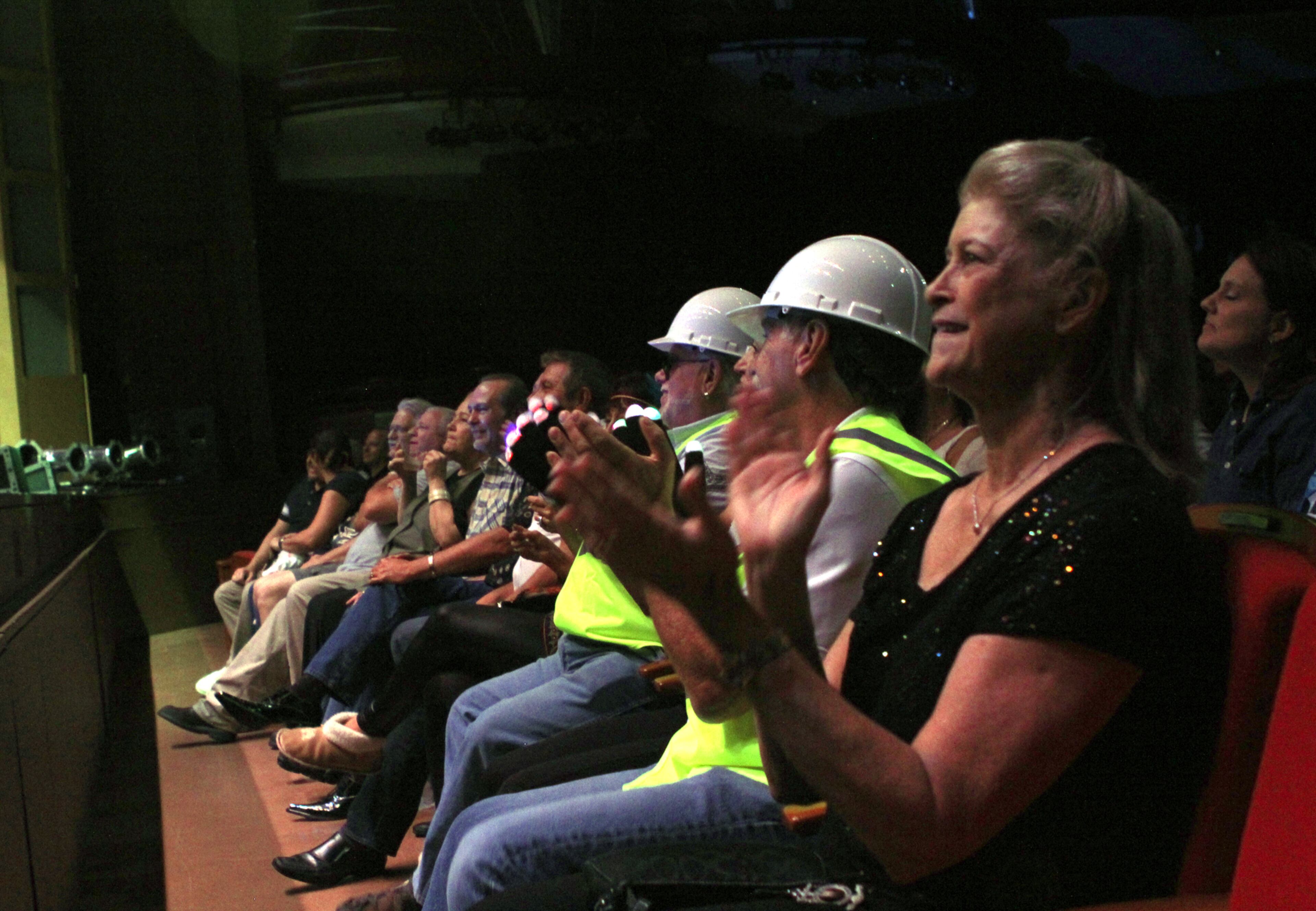 Fans of the Village People pay tribute in construction worker hats , as they perform at the Cobb Energy Performance Arts Centre Friday.