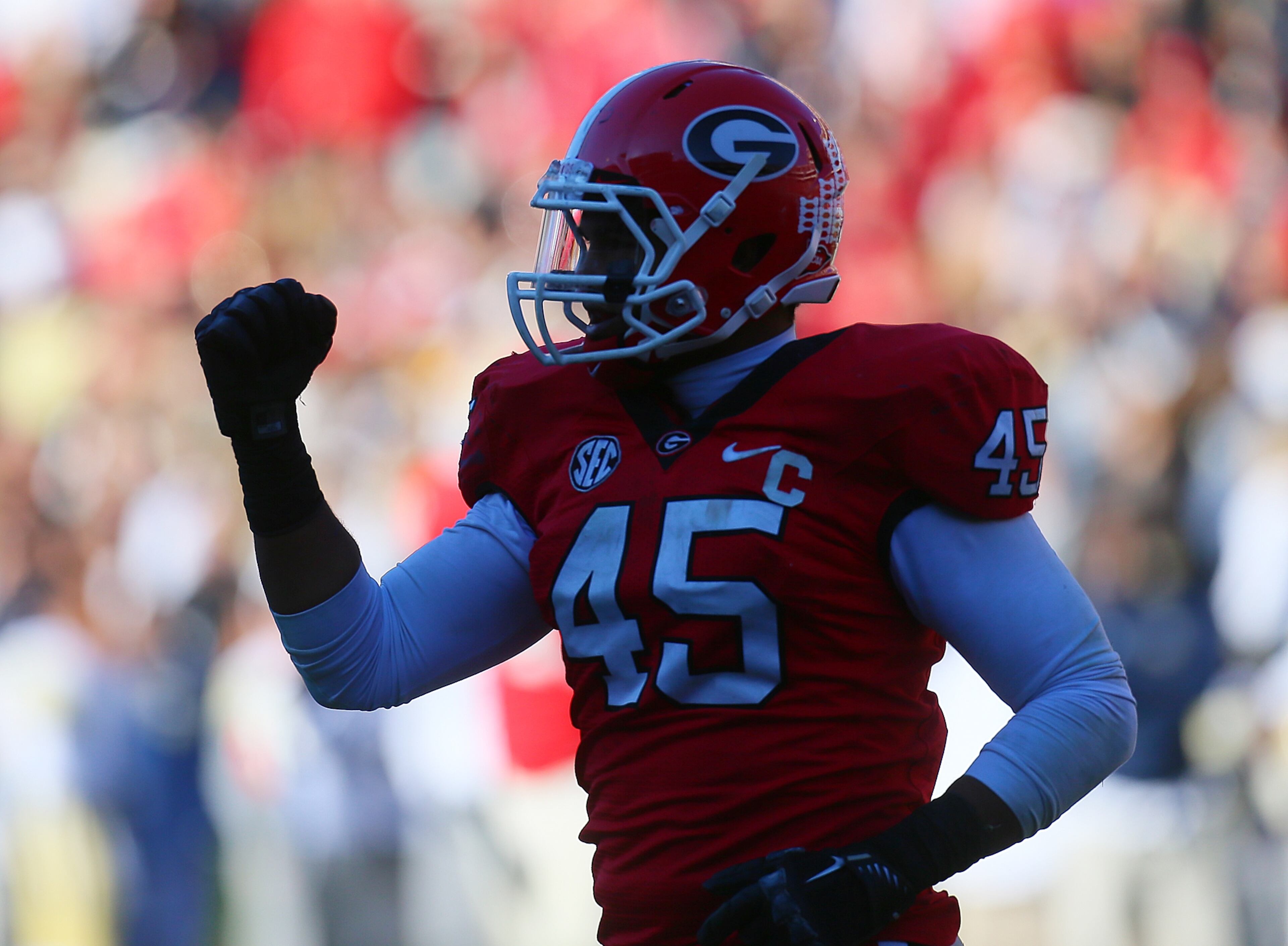 Georgia linebacker Christian Robinson pumps his fist after stopping Georgia Tech on the fourth down during the second half in Athens. The Bulldogs defeated the Jackets 42-10.