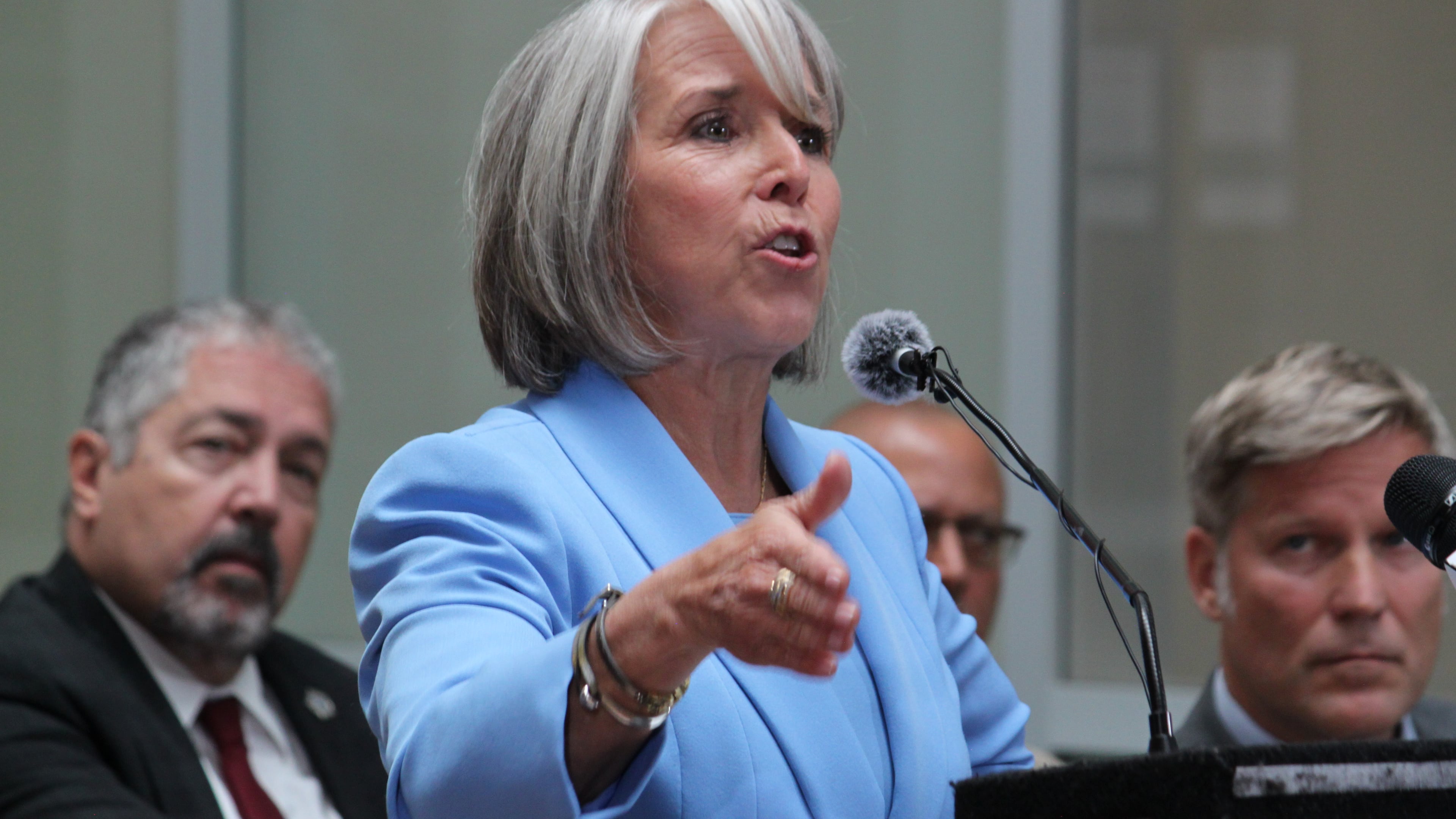 New Mexico Gov. Michelle Lujan Grisham speaks about holding federal authorities accountable for policies that allowed fentanyl pills to reach the streets, during a news conference in Albuquerque, on Monday, June 29, 2026. (AP Photo/Susan Montoya Bryan)