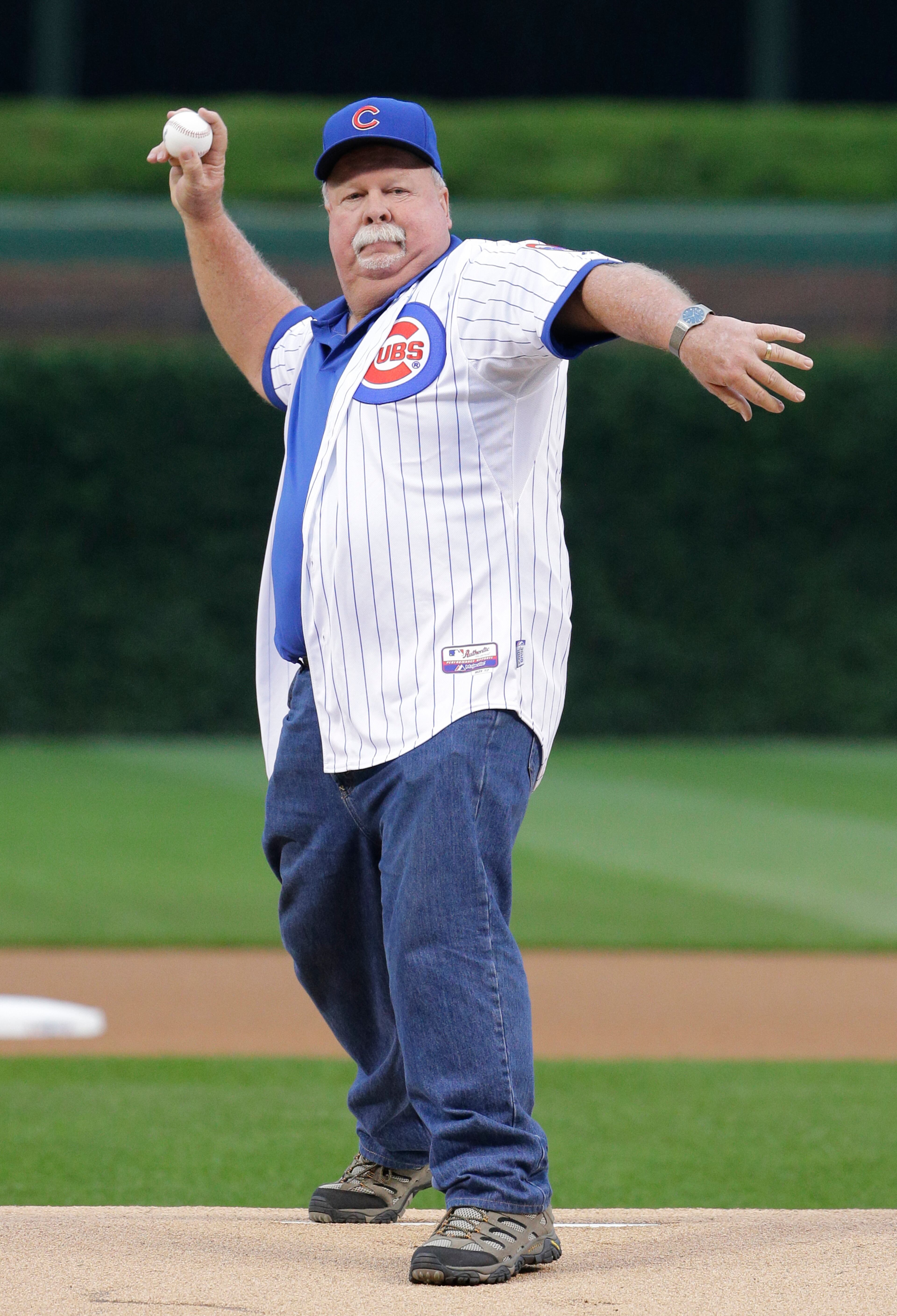 PGA golfer Craig Stadler throws out a ceremonial first pitch before a baseball game between the Chicago Cubs and the St. Louis Cardinals Wednesday, July 8, 2015, in Chicago. (AP Photo/Nam Y. Huh)