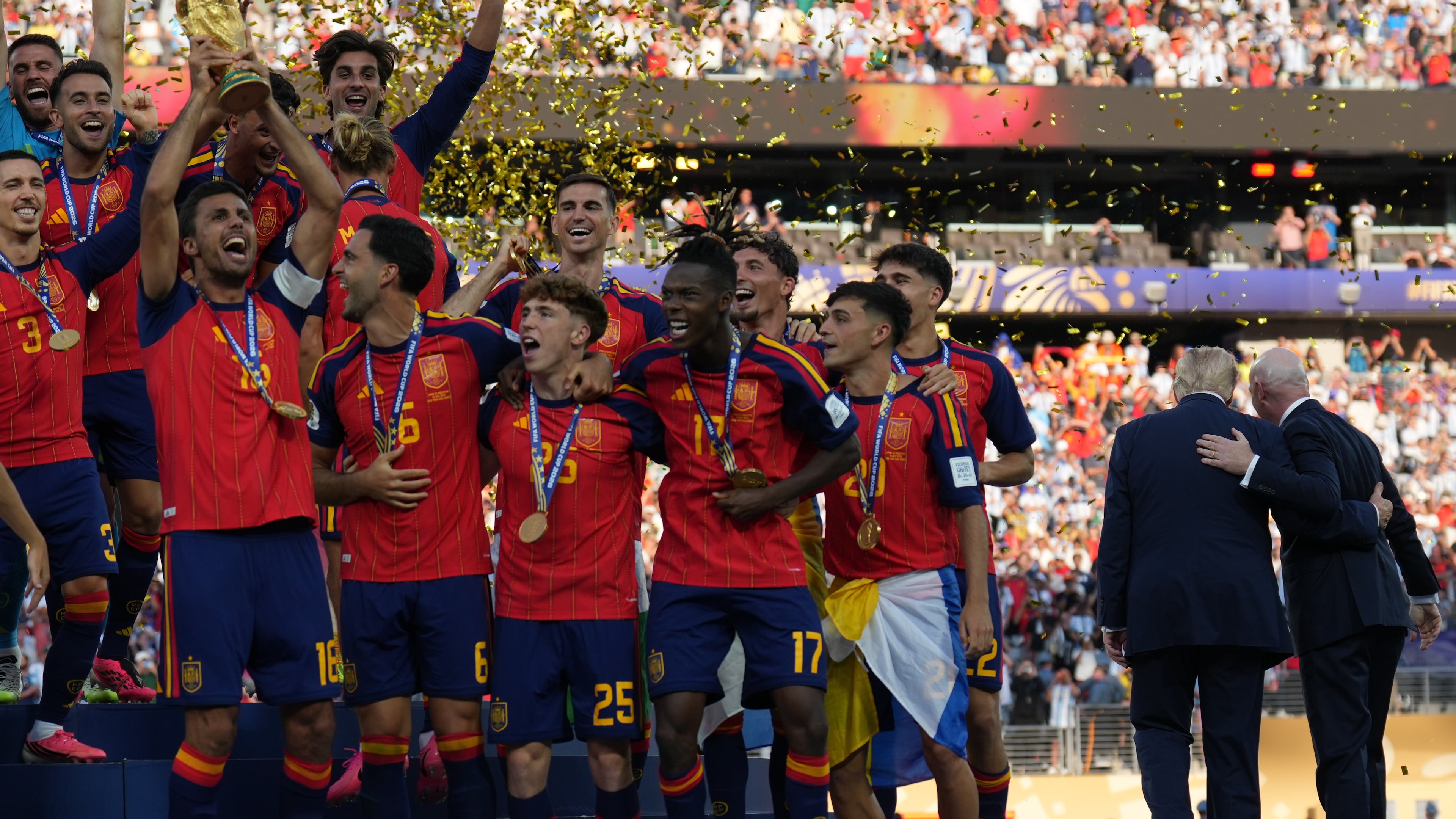 Spain players, from left, cheer alongside President Donald Trump and FIFA President Gianni Infantino at the conclusion of the World Cup championship final soccer match between Spain and Argentina in East Rutherford, N.J., Sunday, July 19, 2026. (AP Photo/Jacquelyn Martin)