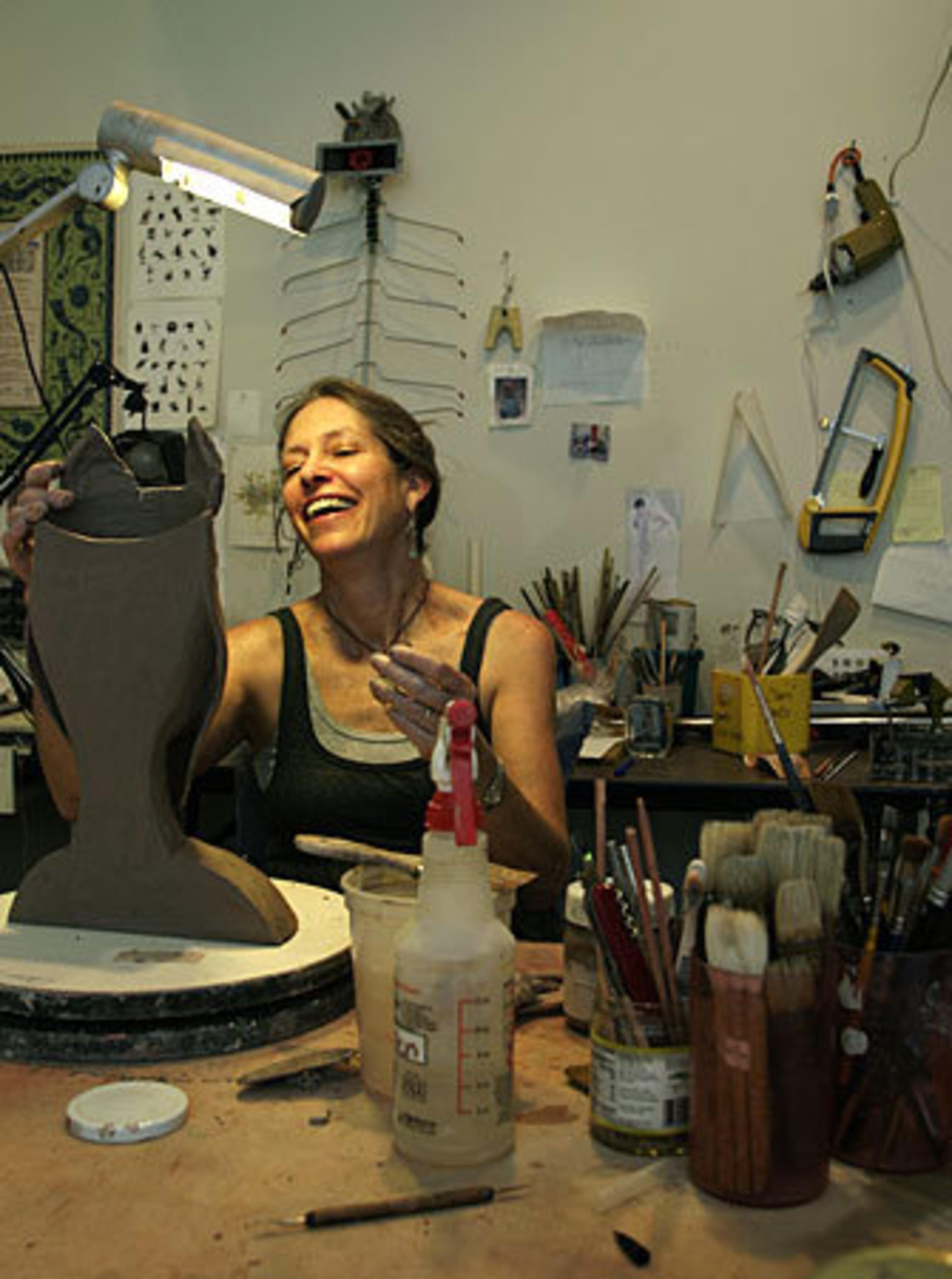 Lewis works on a piece in her studio.
