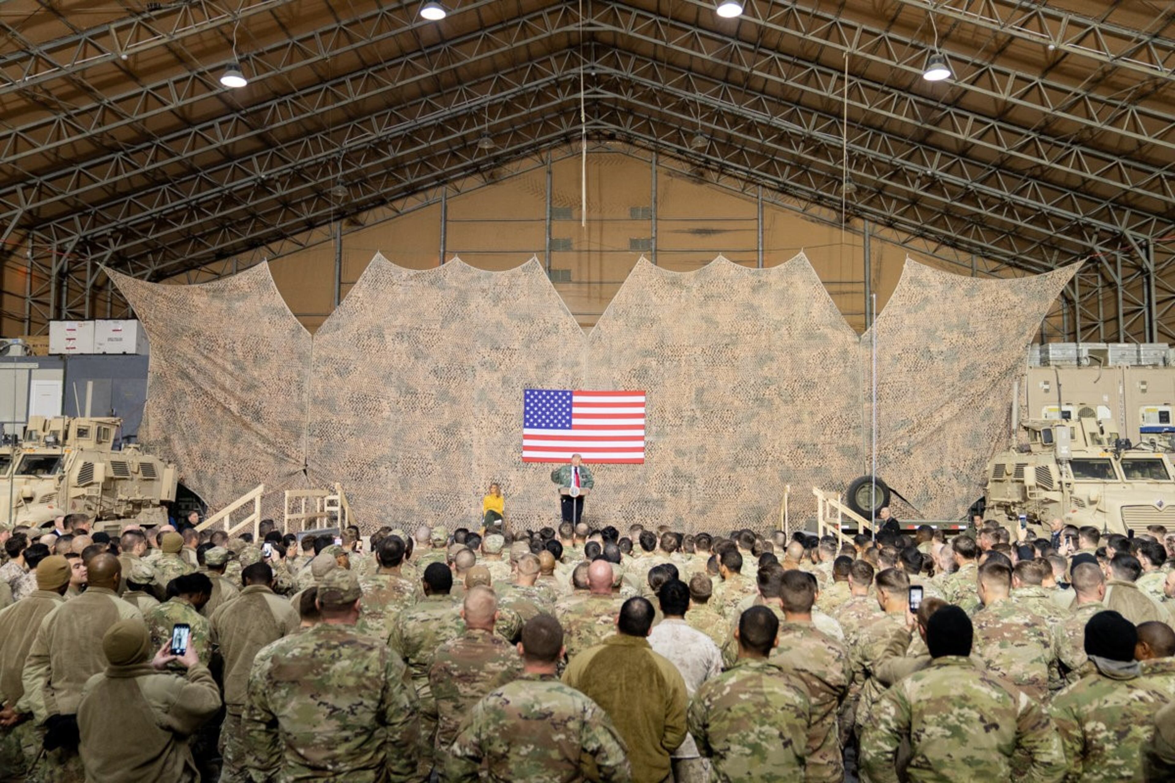 President Donald J. Trump, joined by First Lady Melania Trump, addresses his remarks to U.S. troops Wednesday, December 26, 2018, at the Al-Asad Airbase in Iraq.