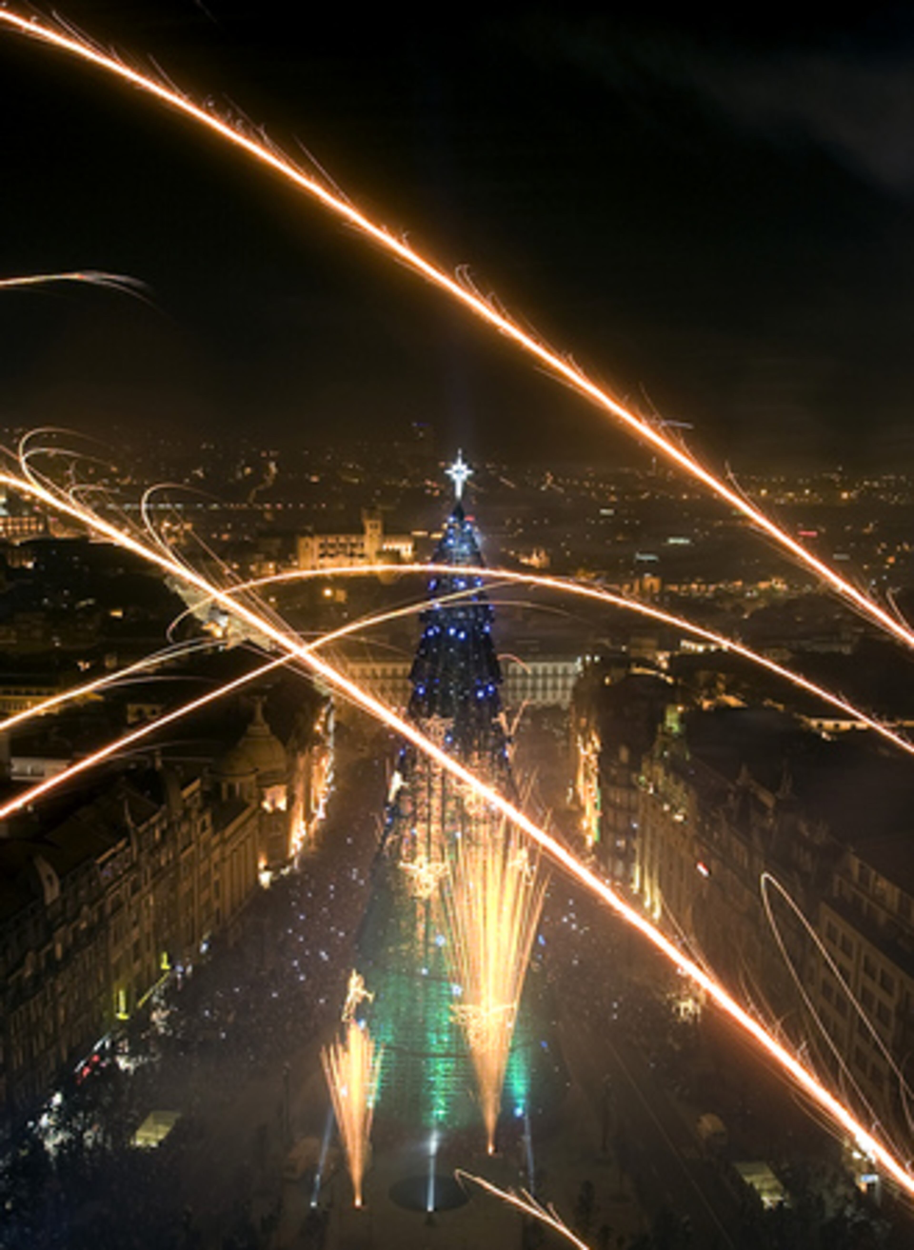 Porto, Portugal: Fireworks explode above Porto's 249-foot tree, which, promoters claim, is Europe's tallest. It took 3 million lights to decorate it.