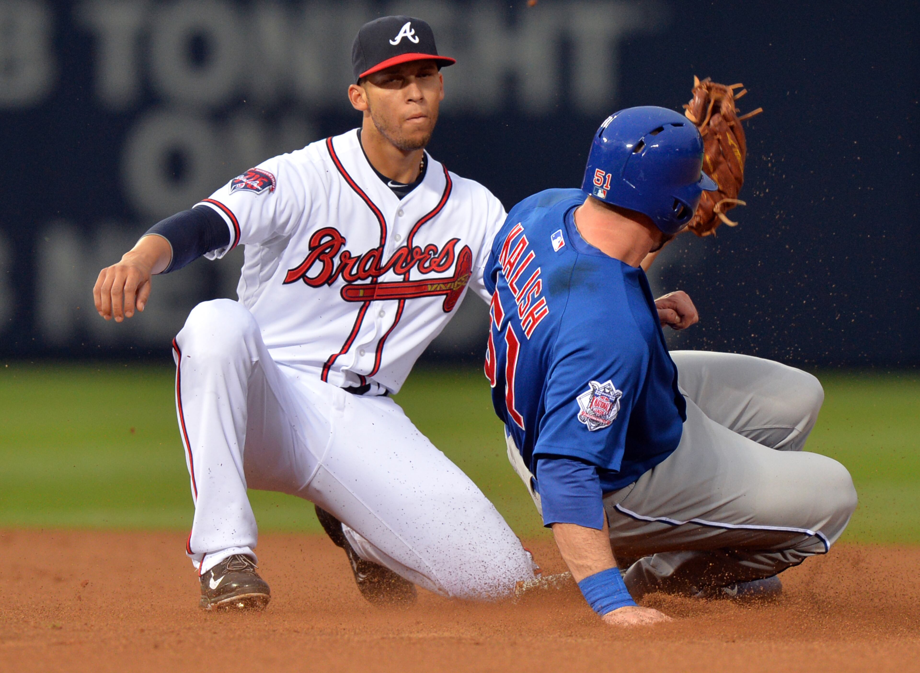 May 9, 2014 Atlanta: Atlanta Braves shortstop Andrelton Simmons tags Chicago Cubs Ryan Kalish on a steal attempt in the first inning at Turner Field Friday May 9, 2014. BRANT SANDERLIN /BSANDERLIN@AJC.COM