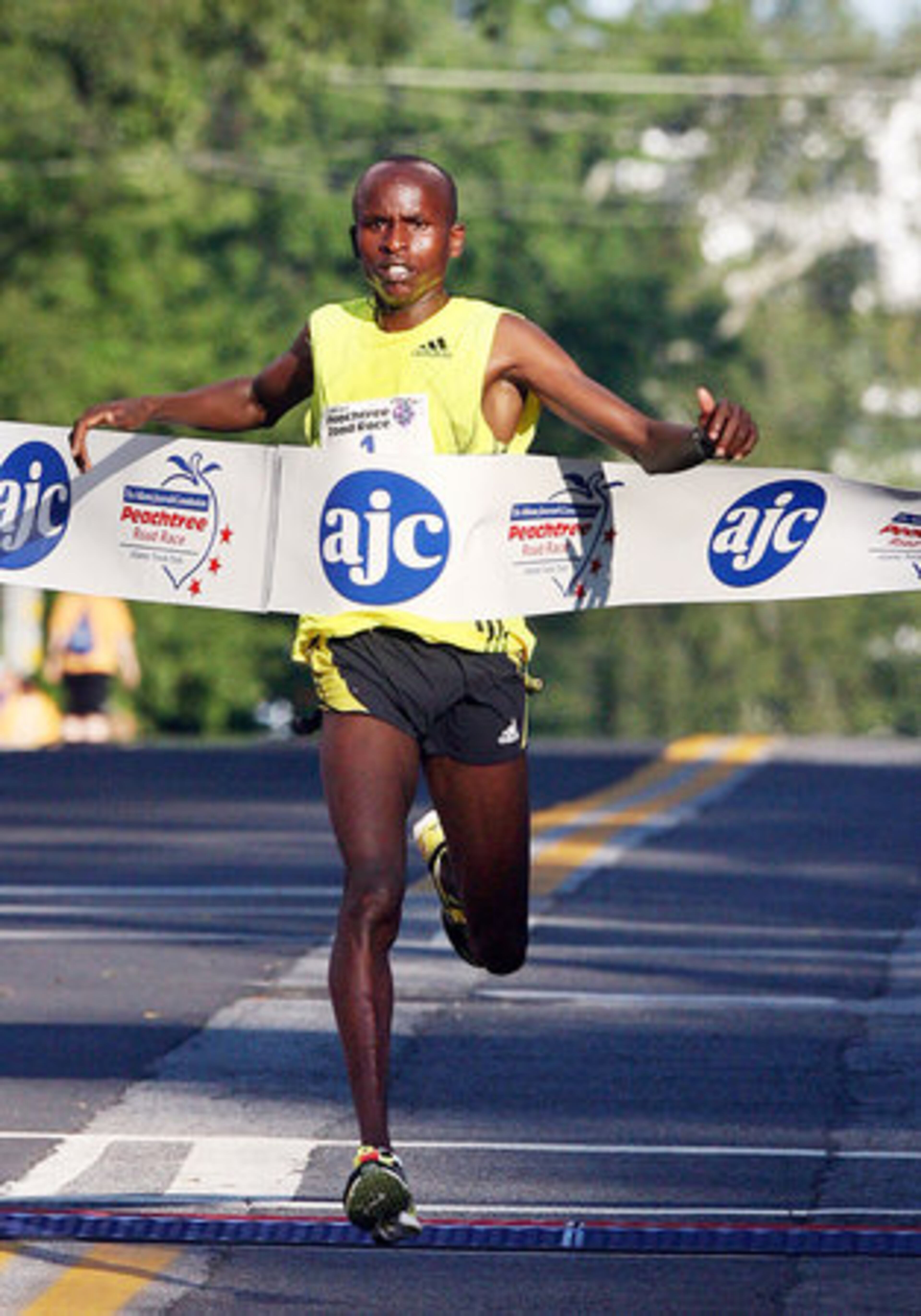 Sammy Kitwara of Kenya won Saturday's AJC Peachtree Road Race for the first time in 27:21. It was his fifth consecutive road race win overall.