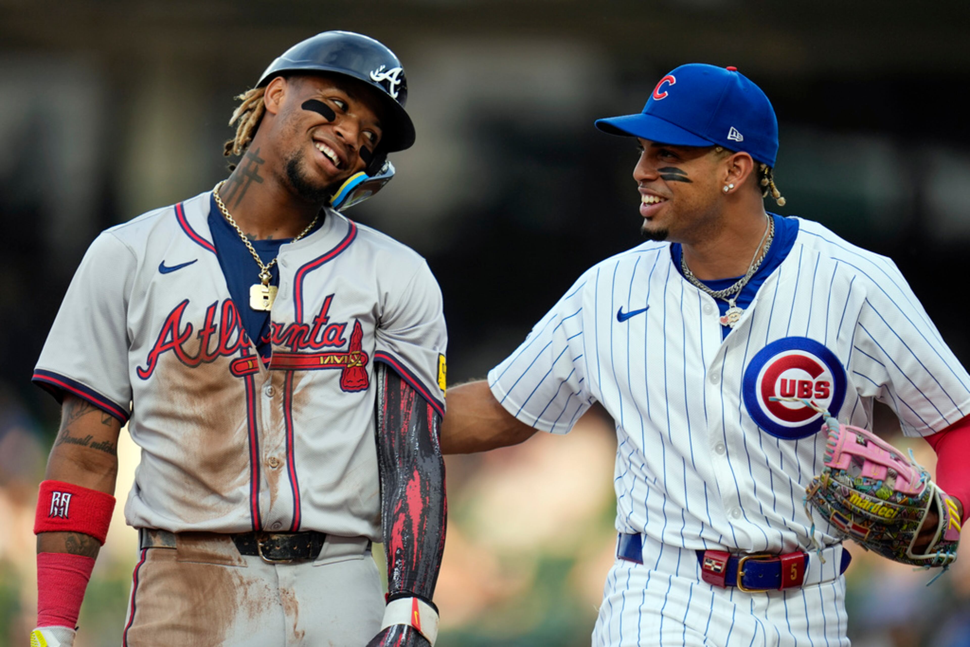 Chicago Cubs third baseman Christopher Morel, right, jokes with Atlanta Braves' Ronald Acuña Jr. (AP Photo/Erin Hooley)