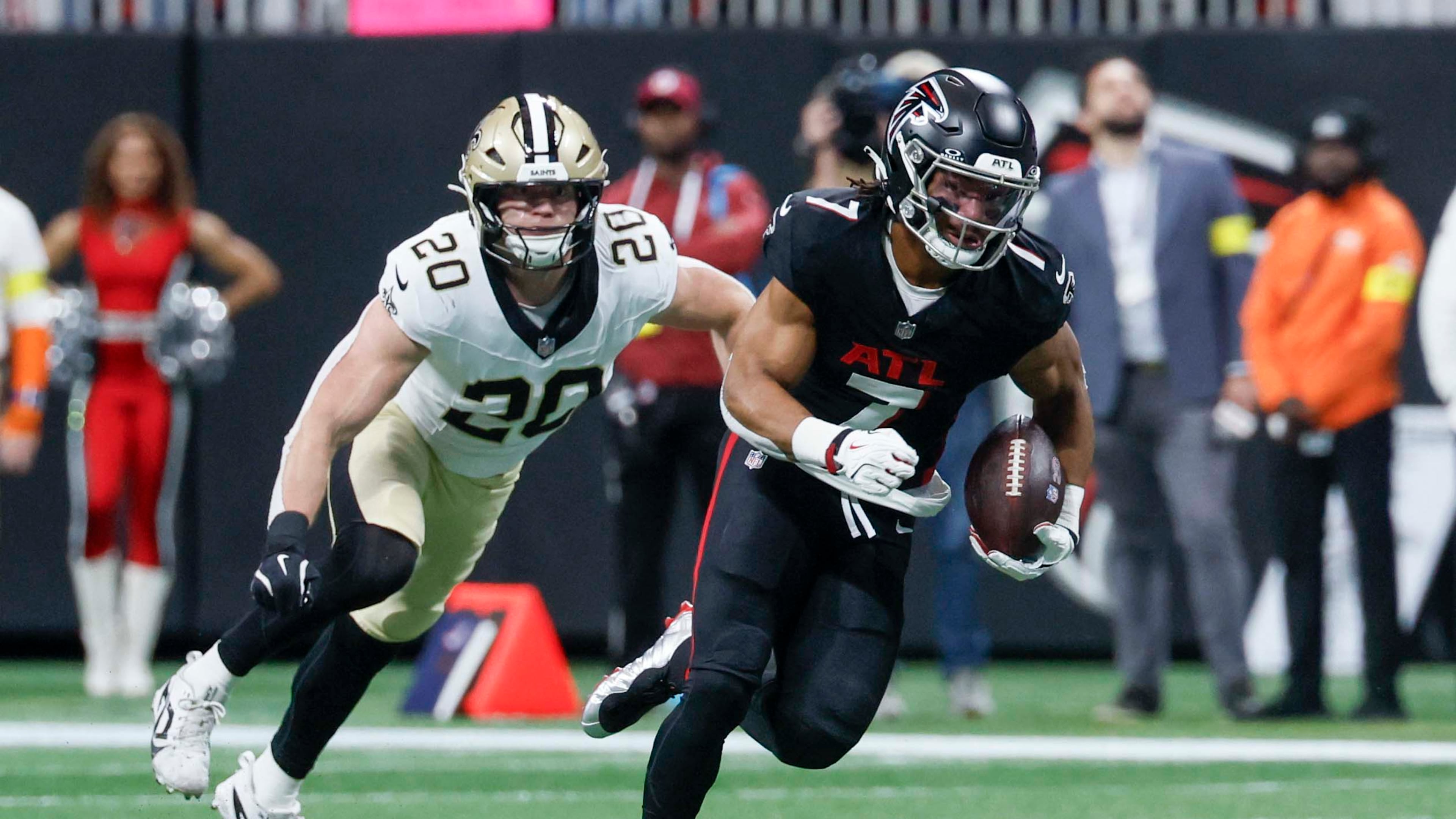 Falcons running back Bijan Robinson (right) rushes with the ball against the New Orleans Saints on Sunday, Jan. 4, 2026, at Mercedes-Benz Stadium in Atlanta. A first-round pick in 2023, Robinson has been electric since coming out of Texas. (Miguel Martinez/AJC)