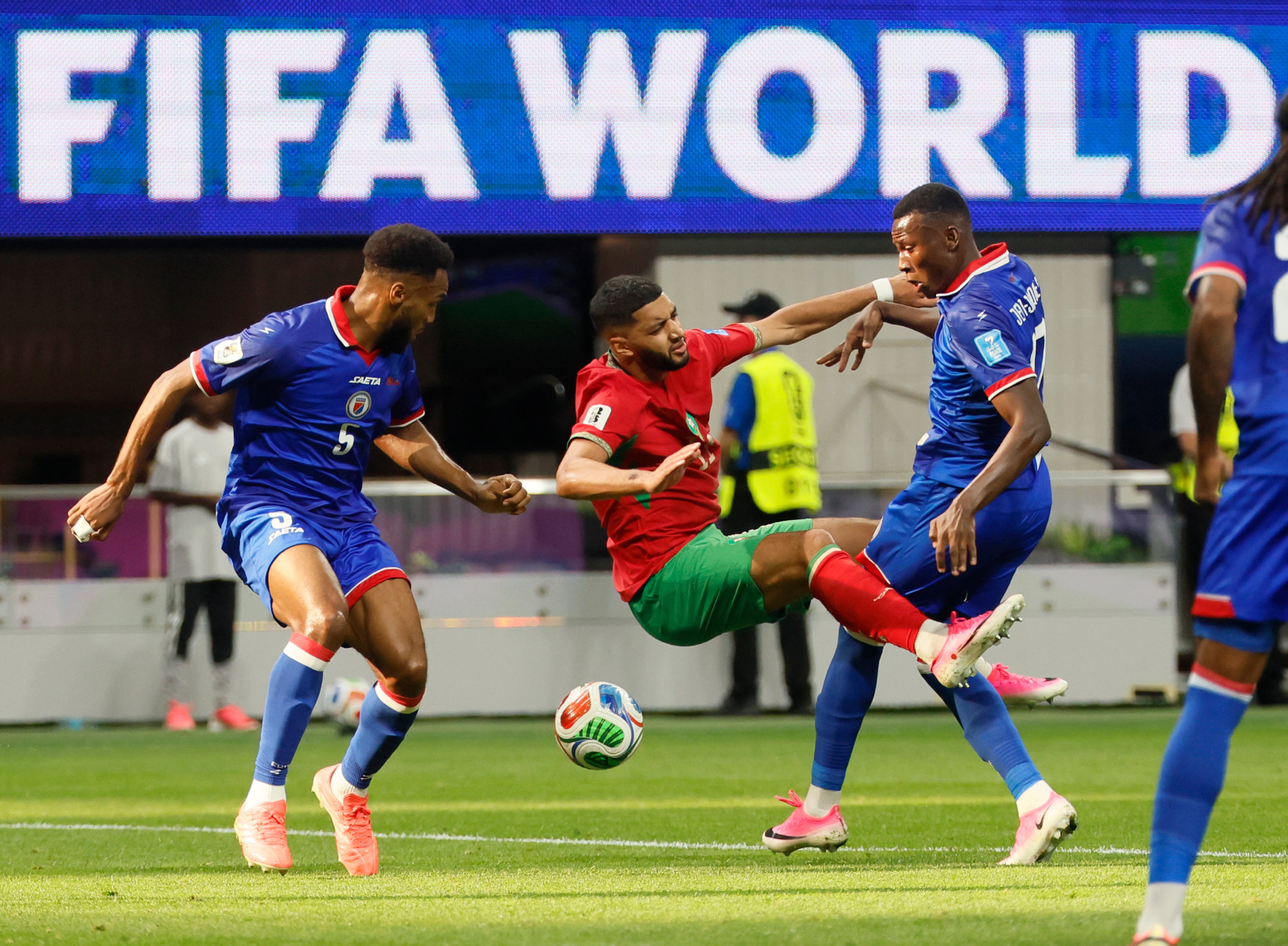 Morocco's Ismael Saibari, center, battles Haiti's Hannes Delcroix, left, and Danley Jean Jacques, right, during first half of Morocco vs. Haiti Group C FIFA World Cup match at Atlanta Stadium (Mercedes-Benz Stadium) on Wednesday, June 24, 2026. (Miguel Martinez/AJC)