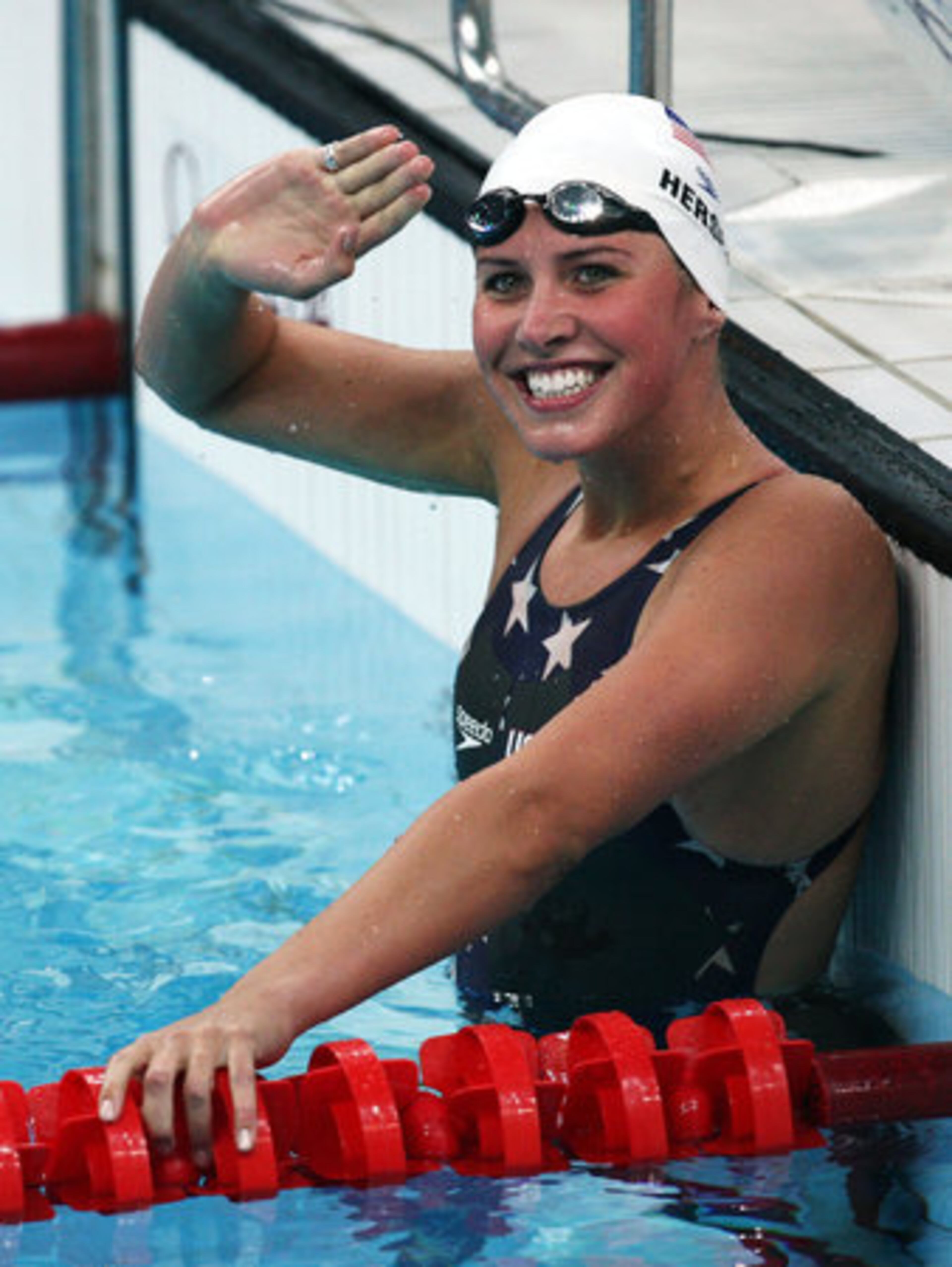 Kathleen Hersey of Atlanta celebrates finishing the Women's 200m Butterfly heat 4 in first place during the fourth day of Olympic competition in Beijing.