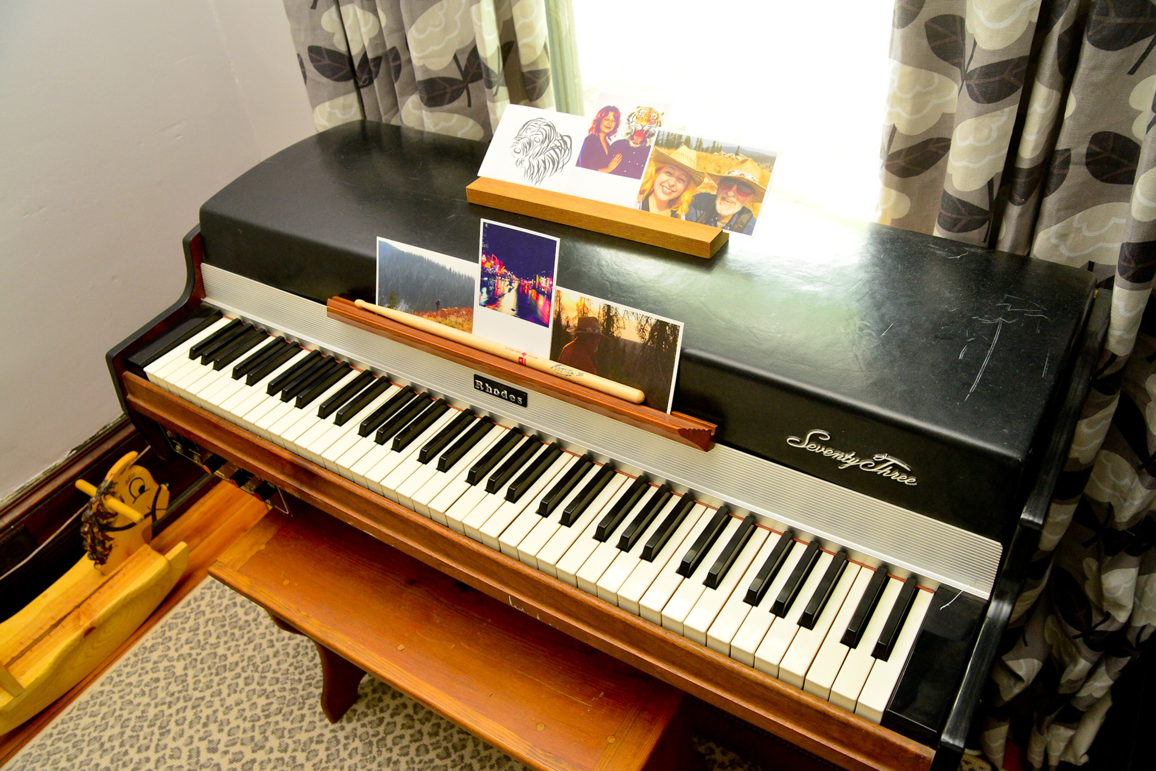 The 1960s Fender Rhodes piano in the corner of Emmylou Niespodziani's nursery is just right for the daughter of musician Nicholas Niespodziani, a member of Atlanta's Yacht Rock Revue and Indianapolis Jones. Custom draperies with P/Kaufmann fabric and a gray and white leopard-print rug from Myers Carpet provide fitting backup.