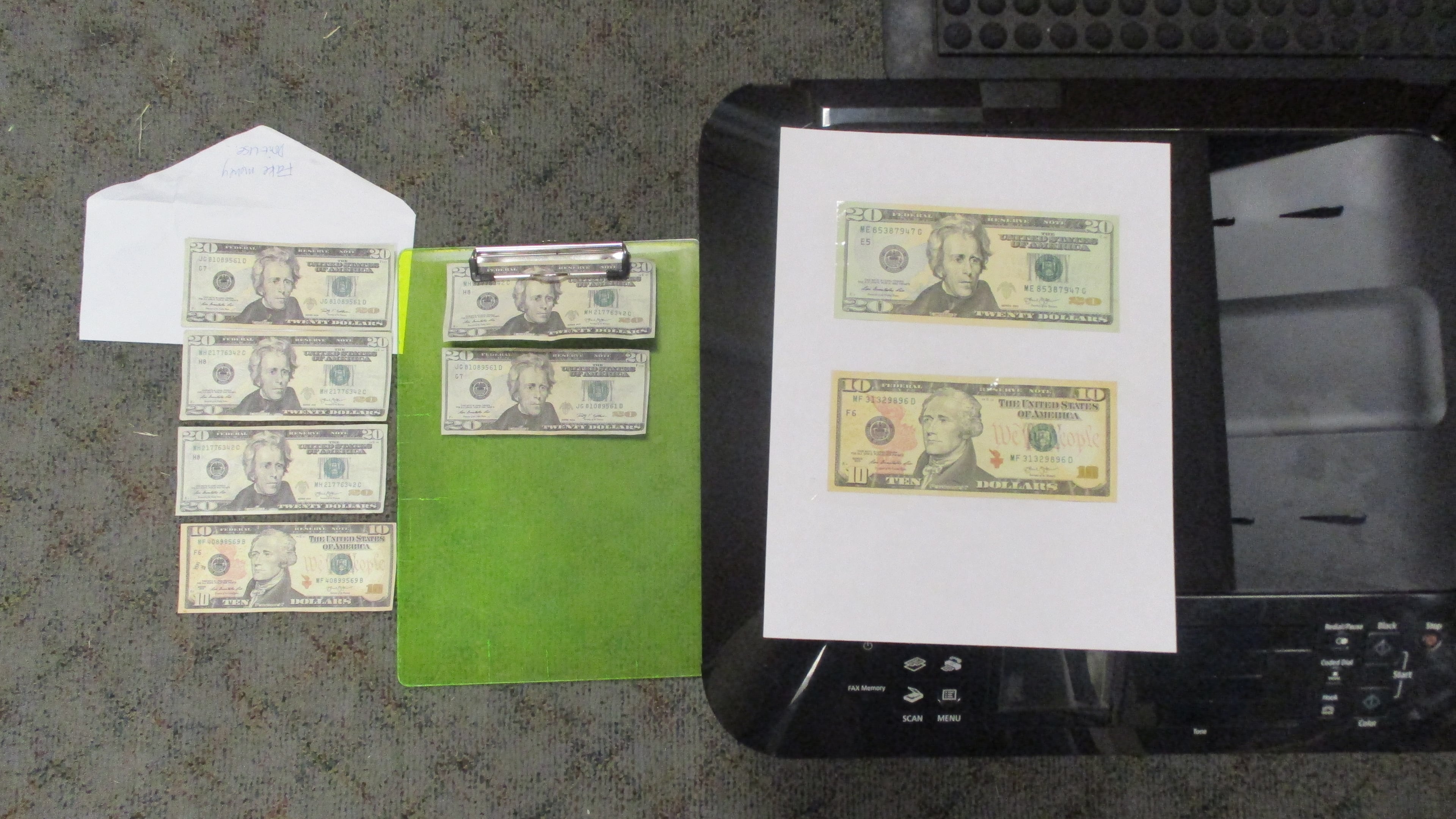 Police said two Athens men were printing money in their hotel room.