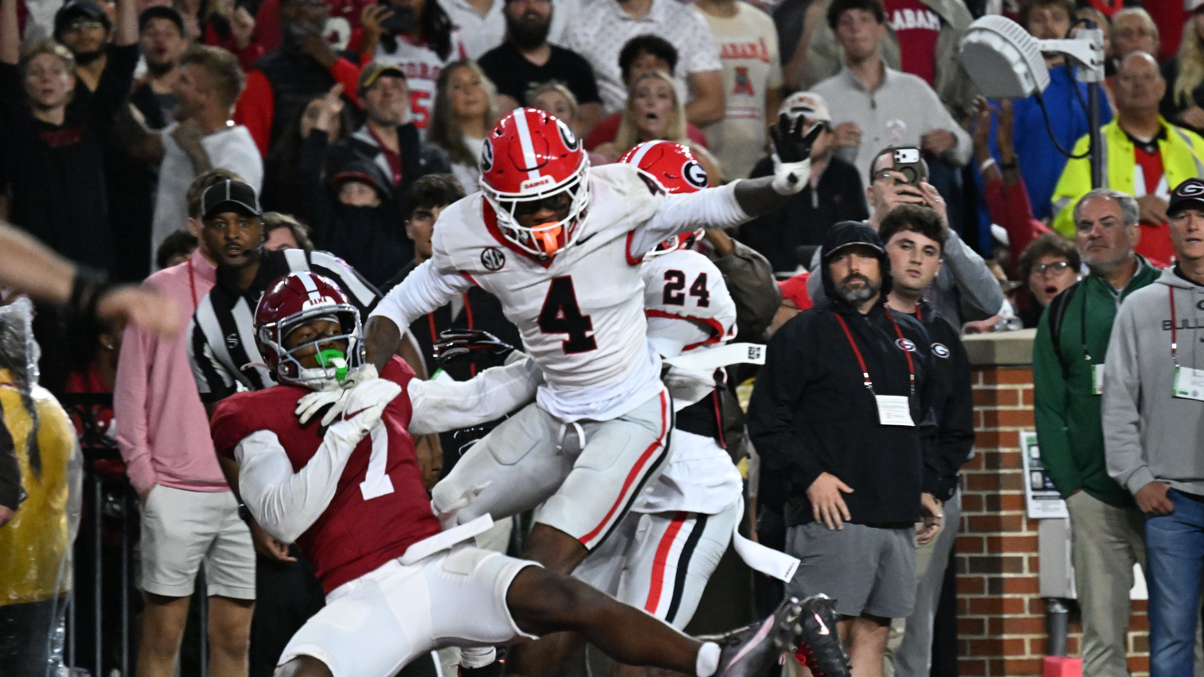 Alabama wide receiver Rico Scott (7) is not able to catch under pressure from Georgia defensive back KJ Bolden (4) during the second half in an NCAA football game at Bryant-Denny Stadium on Saturday, Oct. 10, 2026, in Tuscaloosa, Alabama. Georgia won 20-17. (Hyosub Shin/AJC)