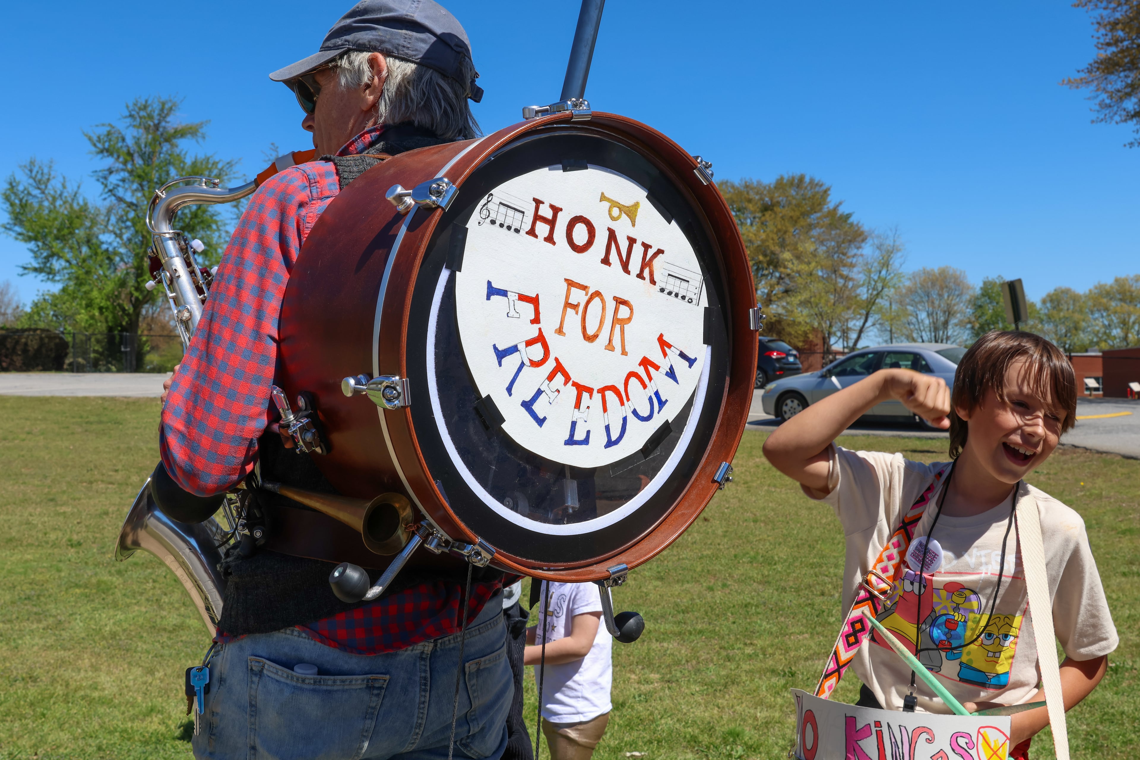 People of all ages protest in Athens on Saturday, March 28, 2026. Protesters gathered in 10 different locations around Georgia’s Congressional District 10, leading up to a “Democracy Fair” at Athens’ Bishop Park as part of a nationwide day of “No Kings” demonstrations. Organizers estimate that a few thousand people participated, many of them first-time protesters. (C.J. Bartunek for the AJC)