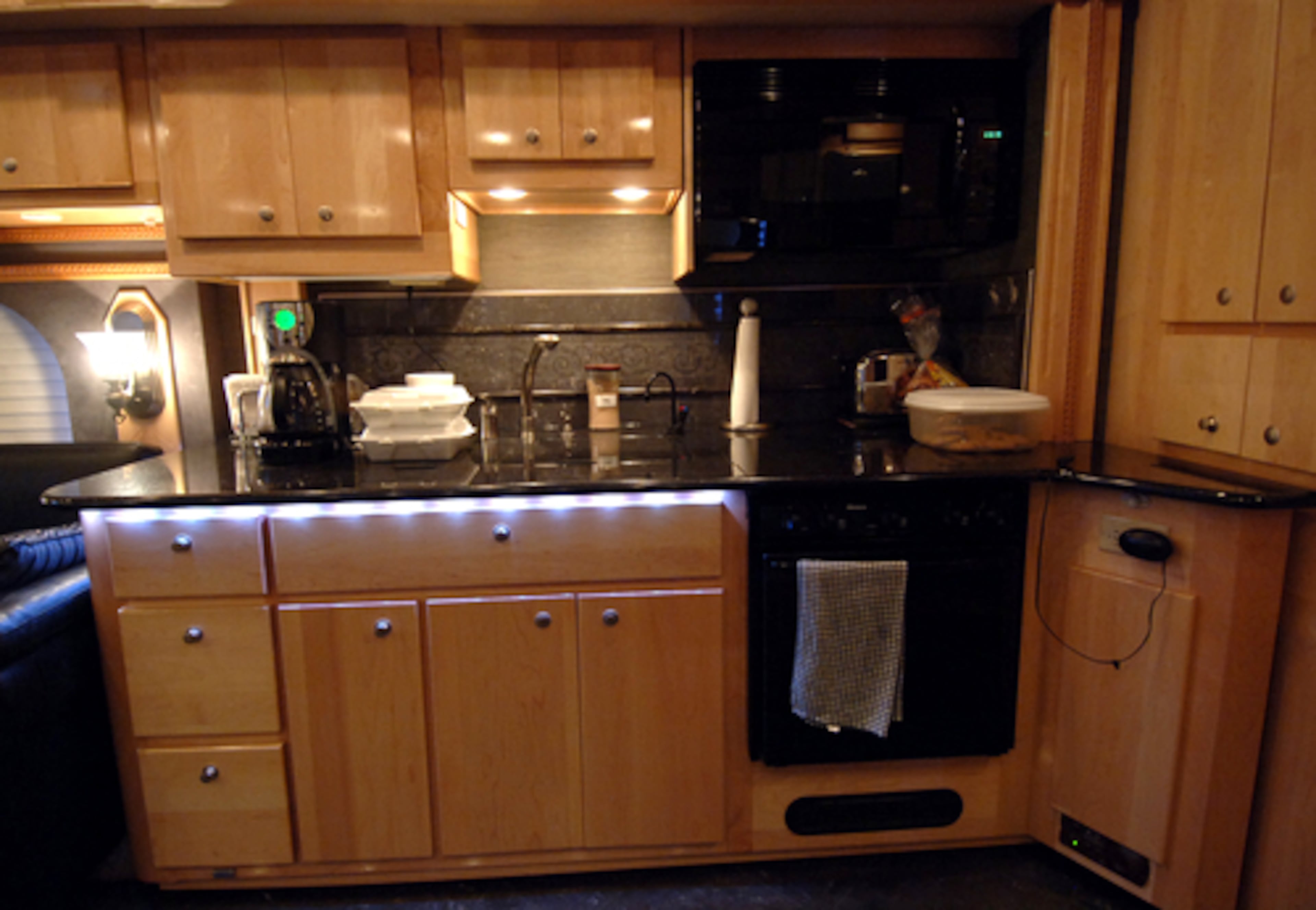 His kitchen includes a full-sized refrigerator, which his driver and "road Dad," Joe Pendrak, restocks at every track.