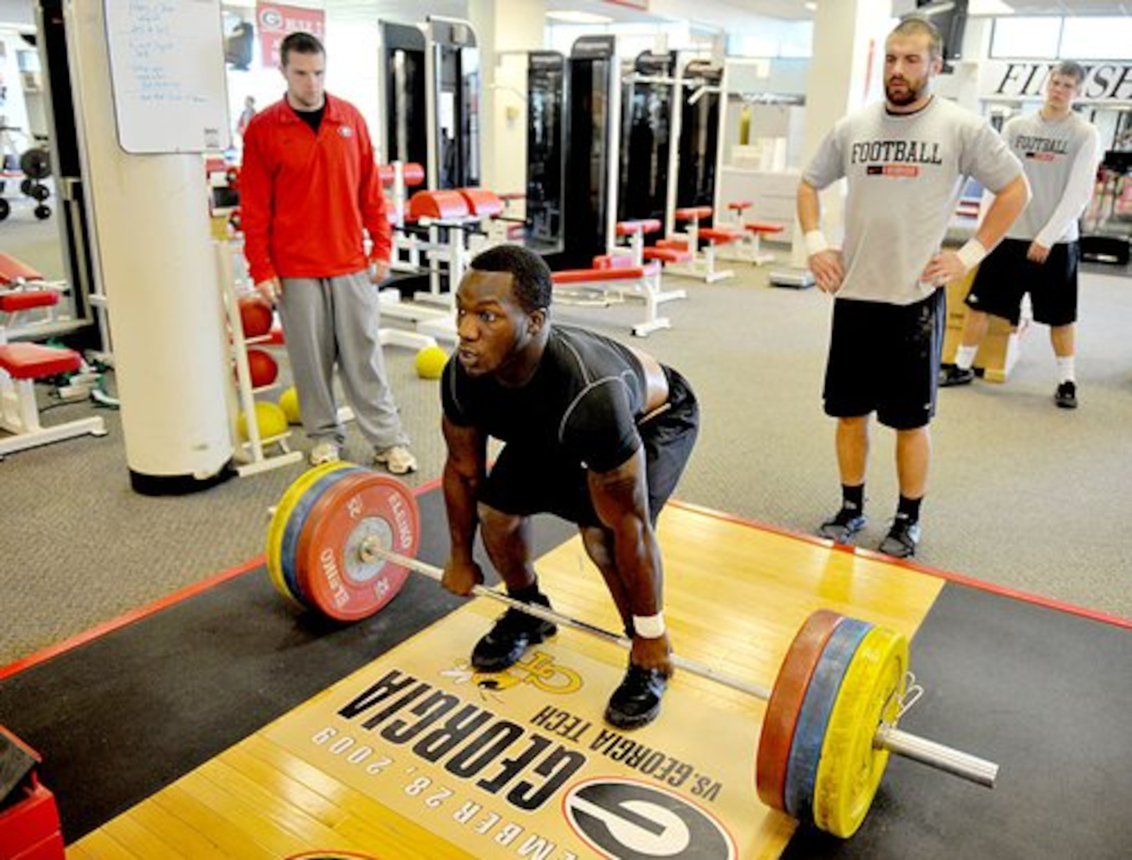 Linebacker Rennie Curran prepares to lift more than 250 pounds as part of his workout regime.