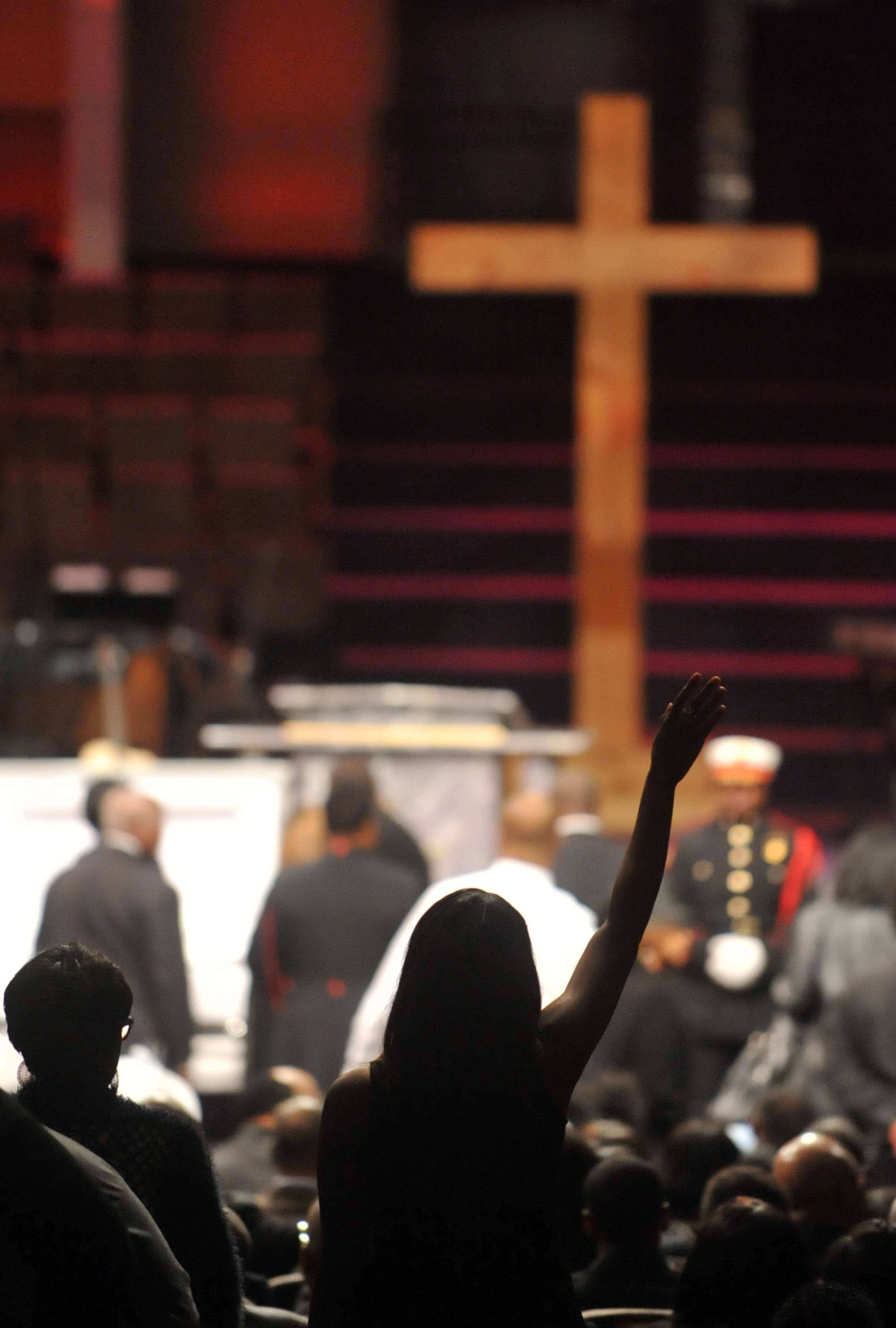 APRIL 18, 2014 ATLANTA A mourner celebrates the life of Jermaine Hall. Atlanta Fire Rescue officials and firefighters joined with family and friends during the funeral of AFRD firefighter Jermaine Hall at New Birth Missionary Baptist Church, Friday, April 18, 2014. Firefighter Hall, 24, died as the result of a brain aneurysm. He was the second AFRD firefighter to die in the last week. Memorial funds for both Hall and Sgt Frank Guinn, who was killed in an accident in New Orleans, have been set up at Wells Fargo branches. Donations can be made to any Wells Fargo branch in the names of Frank Guinn Memorial Fund Jermaine Hall Memorial Fund. KENT D. JOHNSON/KDJOHNSON@AJC.COM