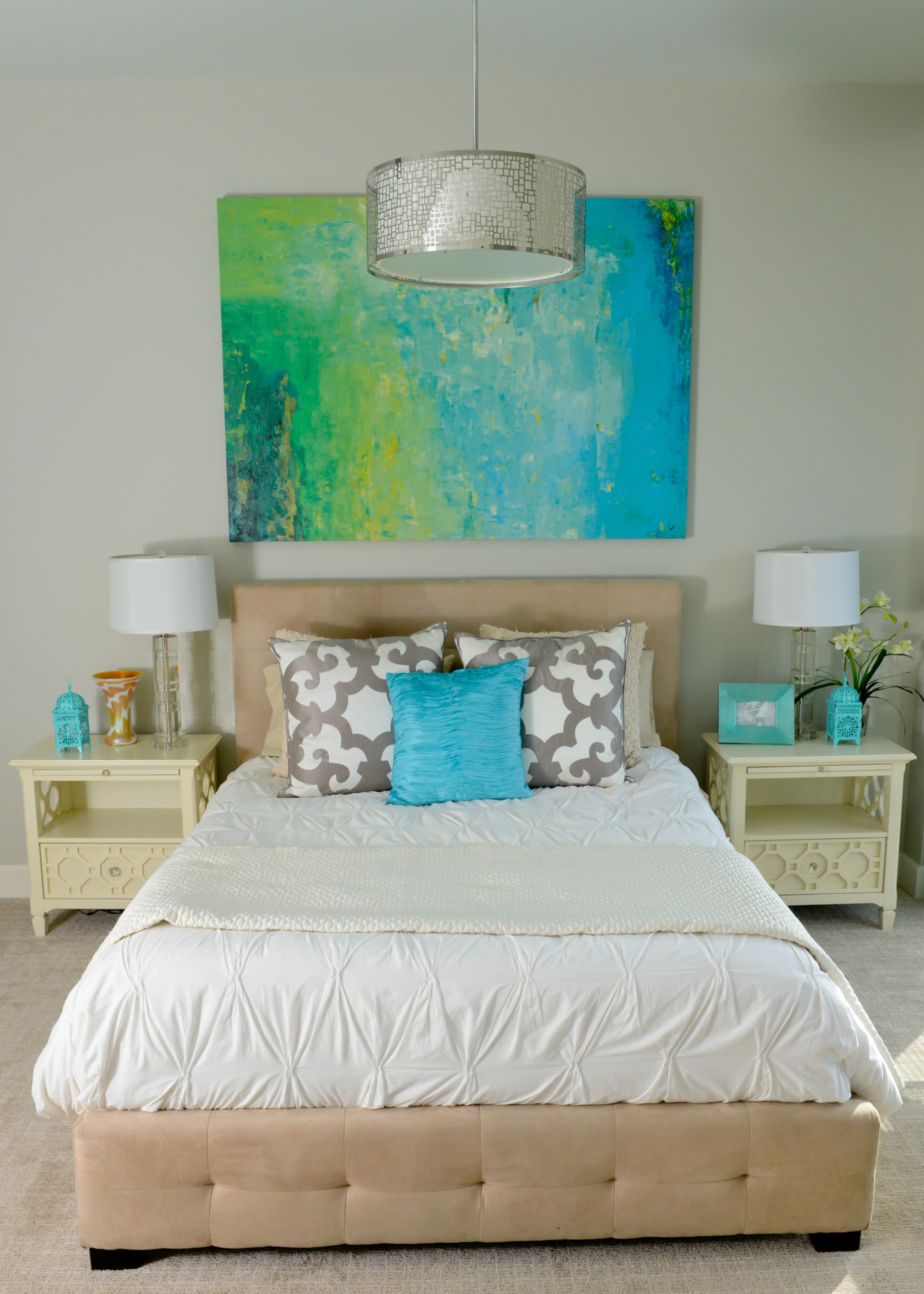 Johnson included a few feminine touches in his guest bedroom for when his mother visits. Bright splashes of turquoise and green in the artwork and accessories stand out against the neutral creams and beiges in the bedroom suite, from Wayfair.