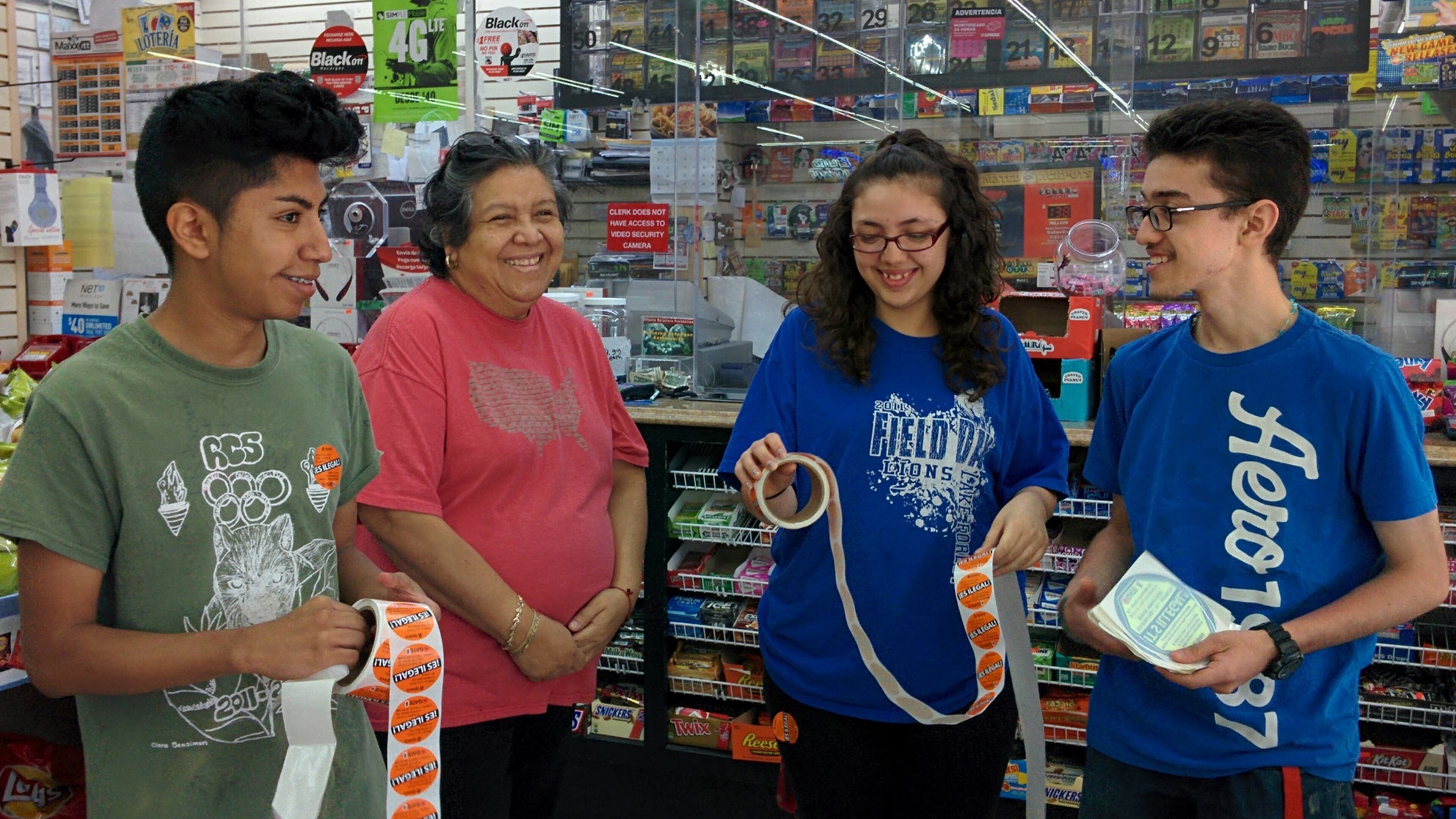 Youths gather for the "Sticker Shock" alcohol prevention campaign.