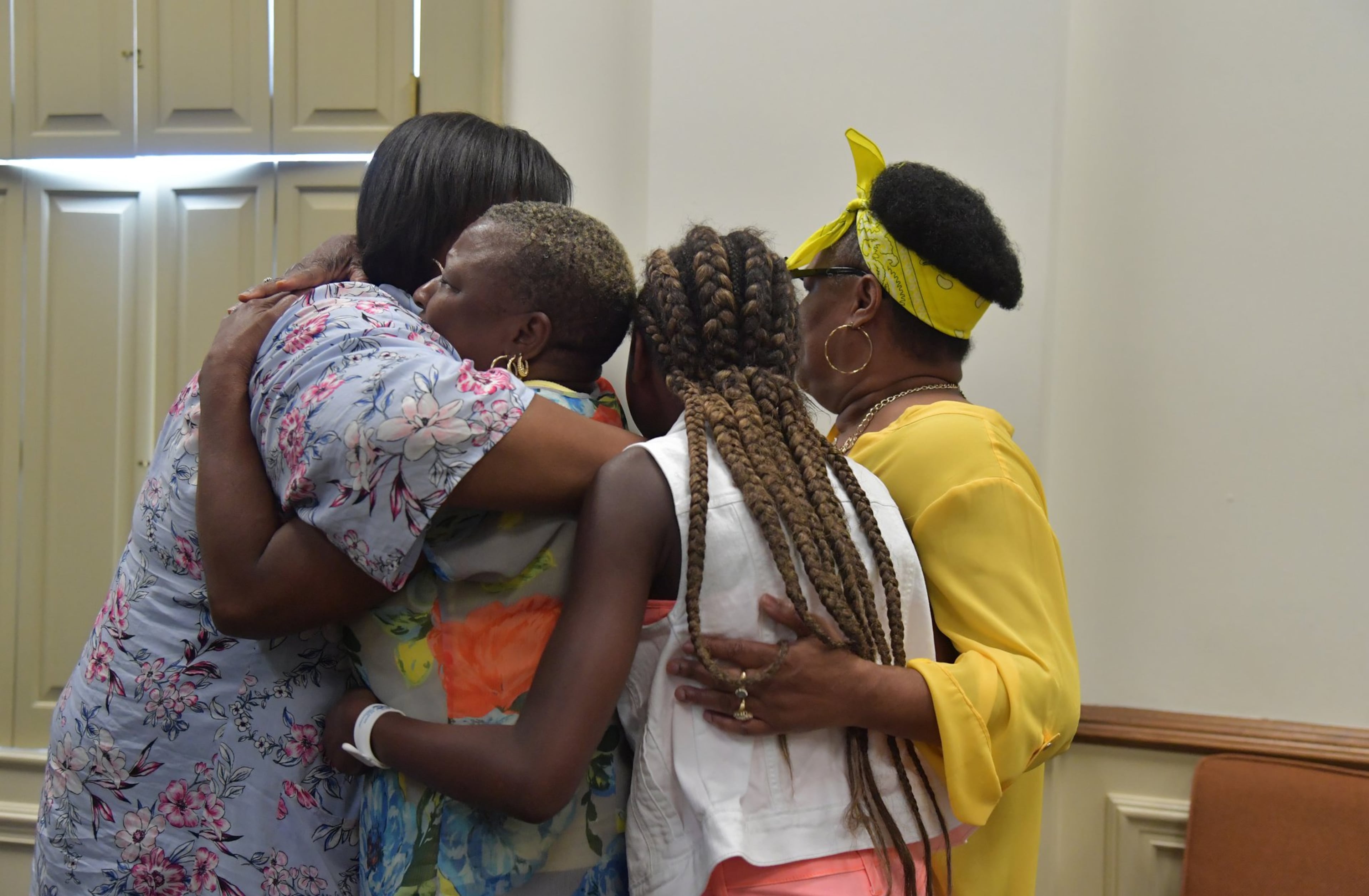 Family members of Timothy Coggins embrace after the murder trial of Franklin Gebhardt at the Spalding County Courthouse on Tuesday, June 26, 2018. The 60-year-old defendant - labeled a racist by his own lawyer - will spend the rest of his life behind bars for the 1983 crime. Franklin Gebhardt was charged with killing 23-year-old Timothy Coggins, stabbing him 30 times and dragging his body behind a pickup truck.