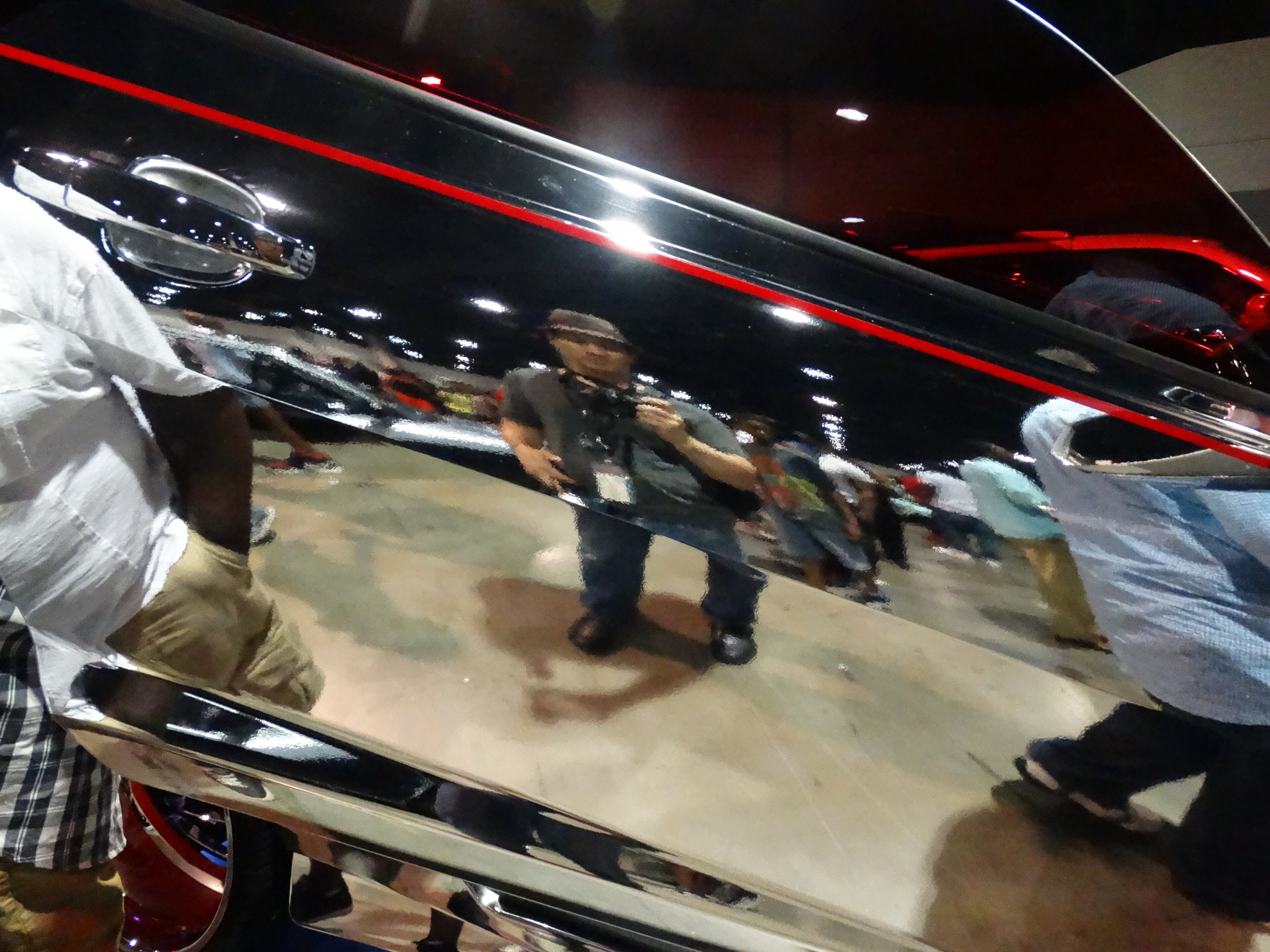 And since I was feeling artsy, I took a "selfie"-style shot of myself through the reflection of a very very reflective Camaro. CREDIT: Rodney Ho/ rho@ajc.com