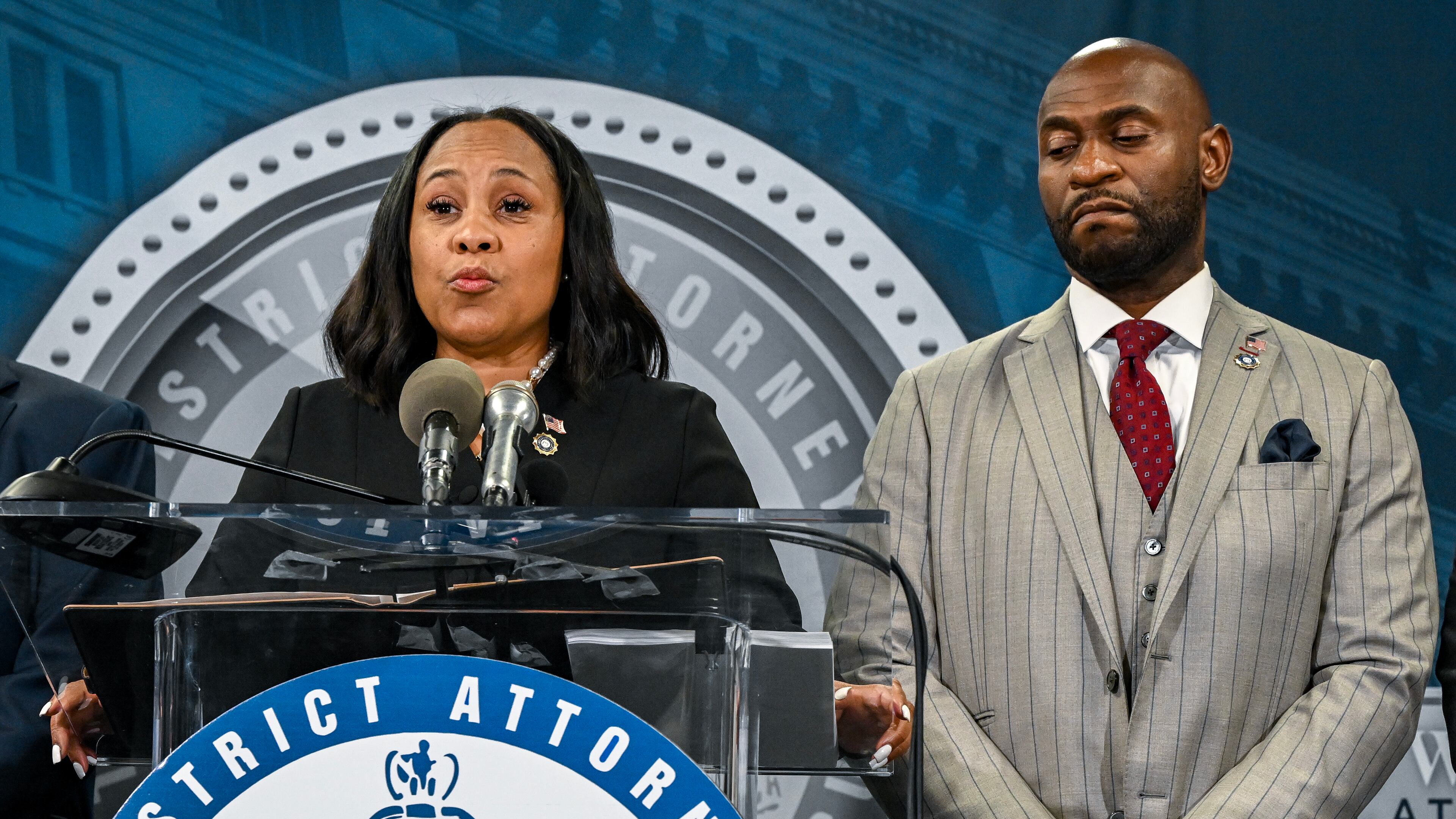 FILE — Fulton County District Attorney Fani Willis appears with special prosecutor Nathan Wade during a press briefing to announce the indictment of former President Donald Trump, in Atlanta on Aug. 14, 2023. The claim that Willis had a relationship with the special prosecutor she hired, Nathan Wade, surfaced on Jan. 8 in a filing from Michael Roman, one of Trump’s co-defendants. (Kenny Holston/The New York Times)