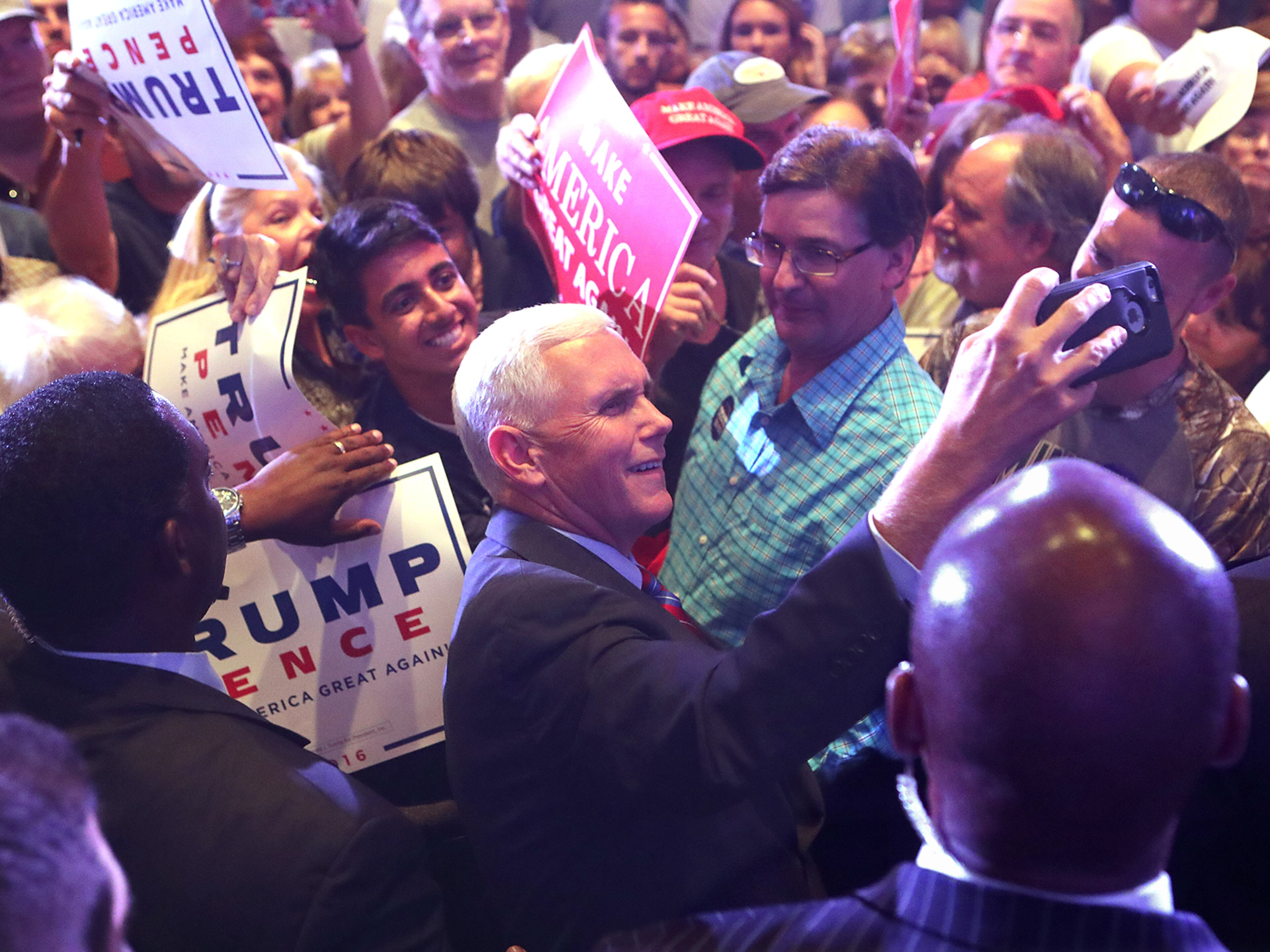 Pence snaps a selfie with a supporter during a campaign stop in Marietta on Monday, August 29, 2016. Curtis Compton /ccompton@ajc.com
