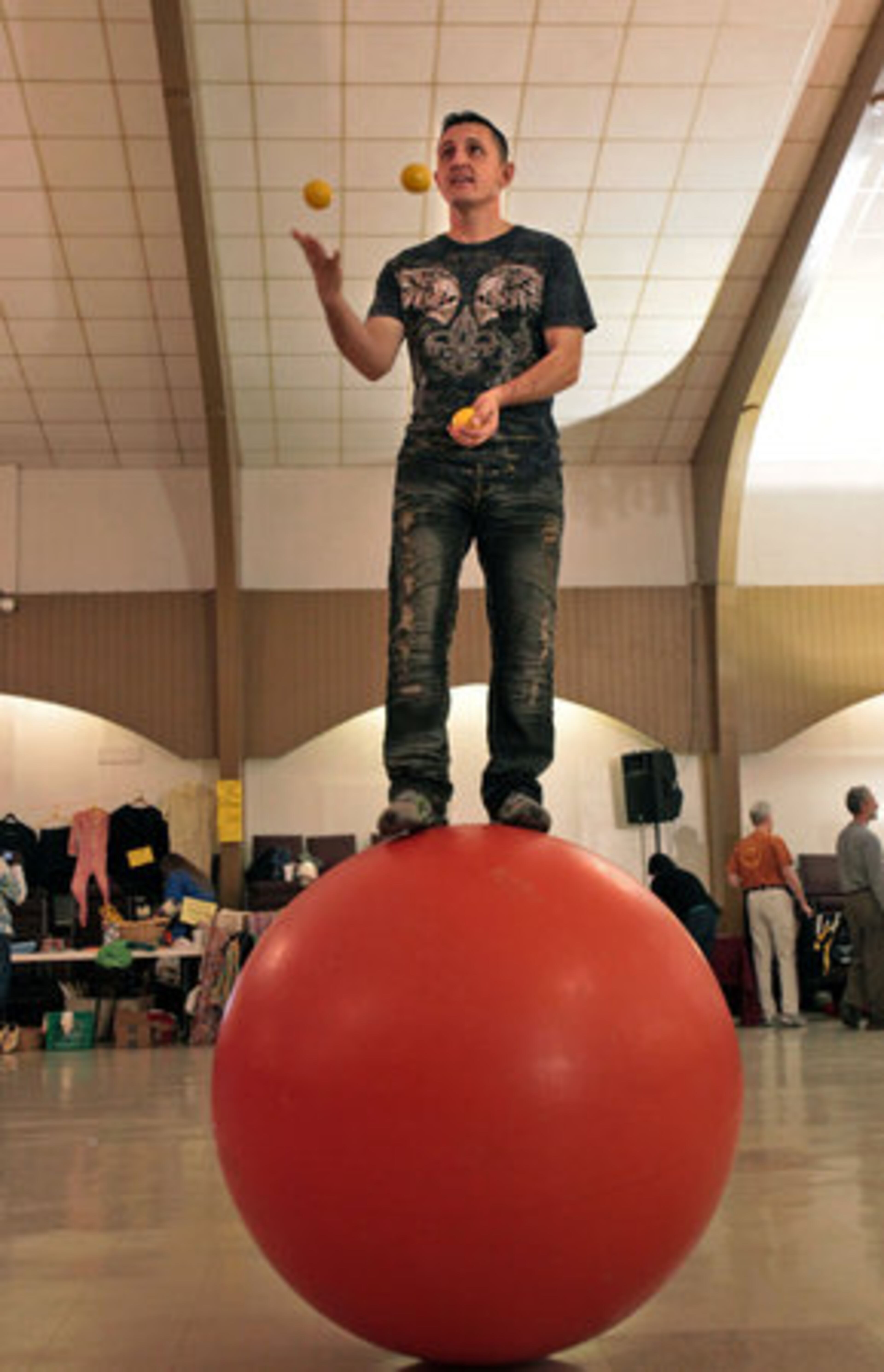 Stephen Smith, of Senoia, juggles while standing on a 70 pound walking globe during the 33rd Annual Groundhog Day Jugglers Festival. Smith is a member of the Cole Brothers Circus and has been coming to this event for about 10 years. Smith says he rarely misses this event because it's a great place to learn a new trick or skill.