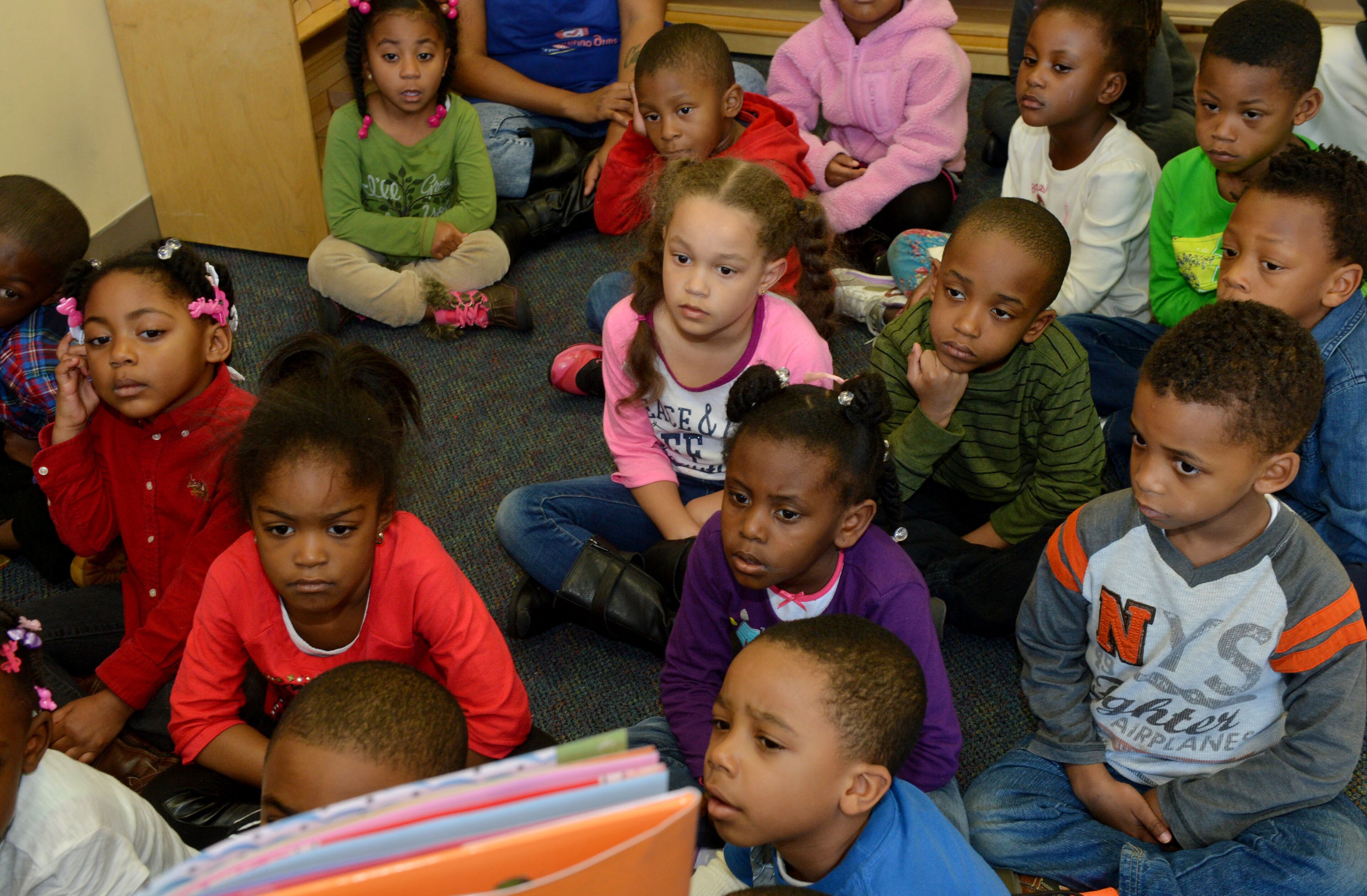 Pre-K students at Sheltering Arms Early Education and Family Center listen to a story and participate in classroom activities at the Fulton Street school Wednesday, March 5, 2014. Georgia's popular, lottery funded pre-kindergarten program is paying off for 4-year-olds, giving them a leg-up on counting and six other skills they need for school, according to a study released on Wednesday. Researchers at UNC Chapel Hill's Frank Porter Graham Child Development Institute found students who completed Georgia pre-k and were headed to kindergarten performed better on seven of 10 school readiness skills than students of the same age who were just entering the program.