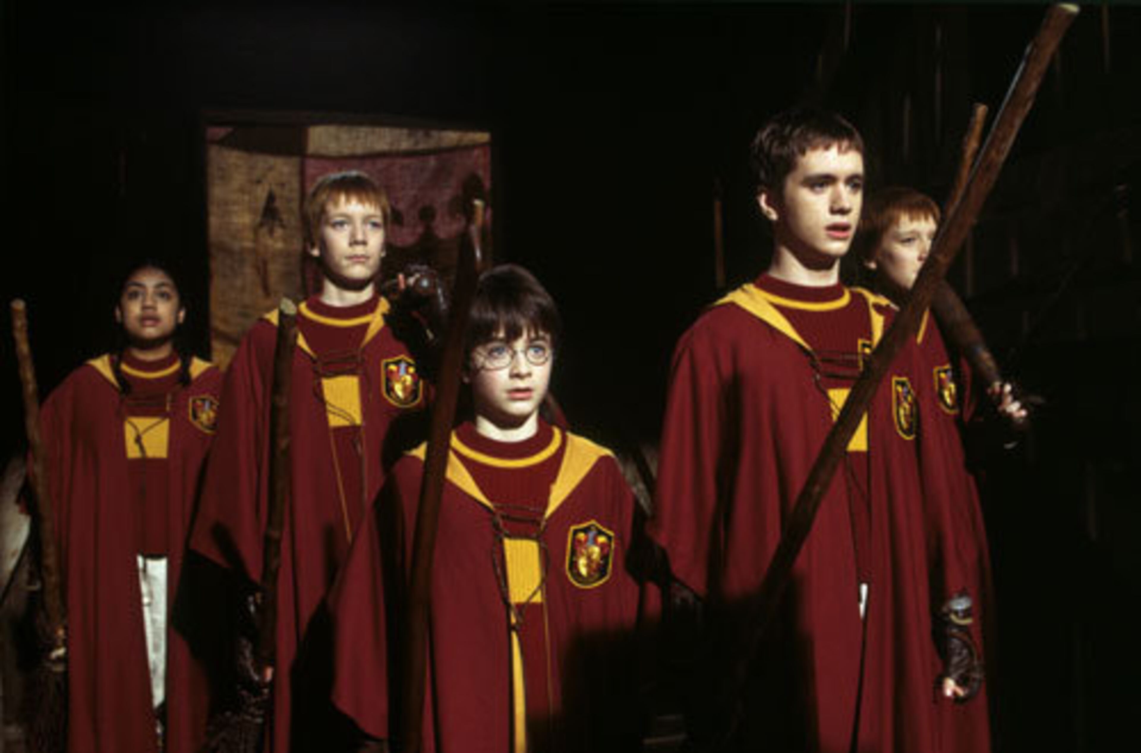 THEN: Ron Weasley's twin brothers, the two gingers shown here with Harry and other young wizards, are played by Oliver and James Phelps. The brothers were 15 years old when they first hit the big screen as George and Fred Weasley. WARNER BROS.